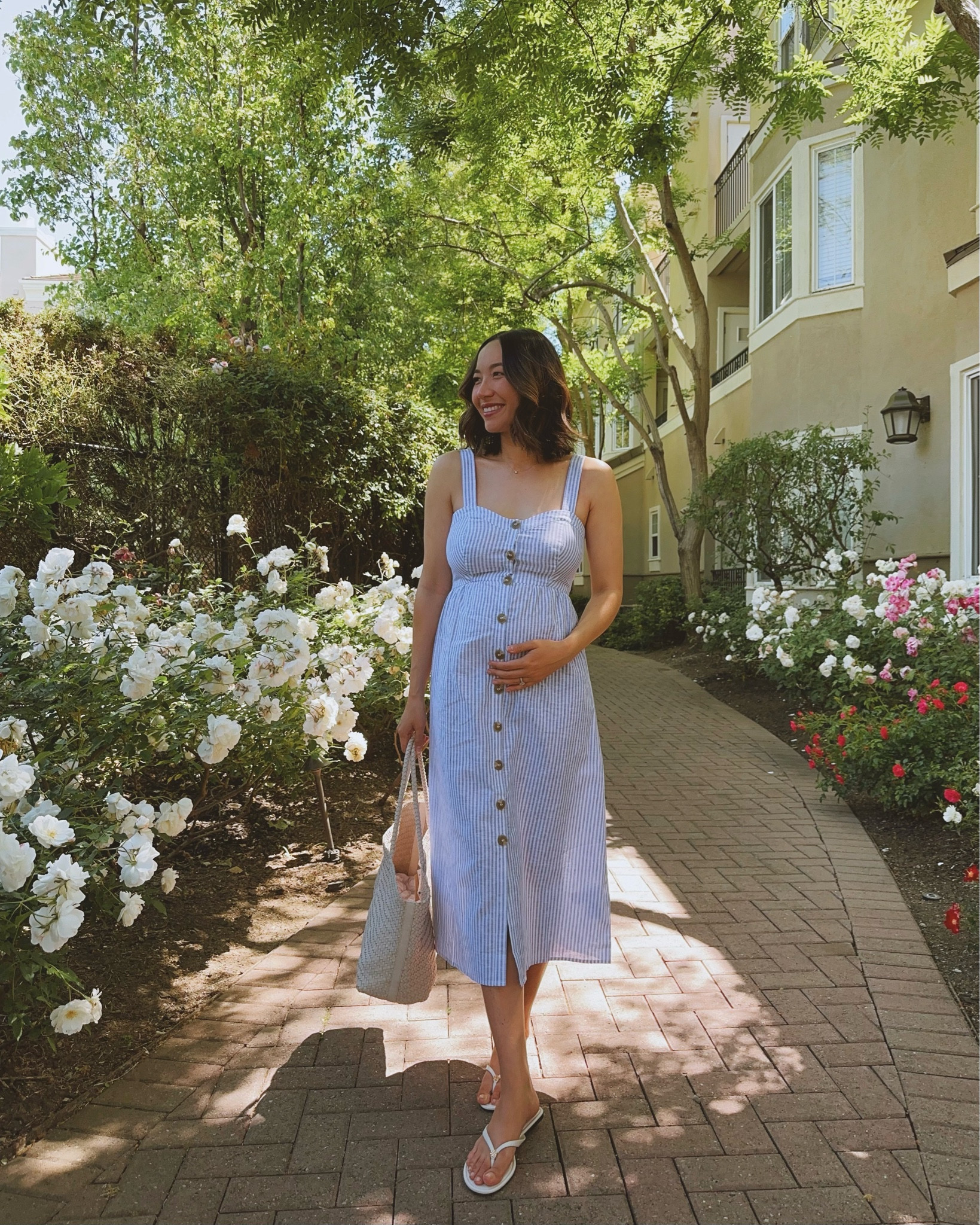 Spring summer maternity linen cotton dress 

Seraphine dress - recommend sizing up from your regular pre-maternity size if you are bigger busted (size 4 would be a better fit, 32DD)
Madewell tote - on sale 
Tory Burch sandals tts

#LTKFindsUnder100 #LTKBump #LTKxMadewell