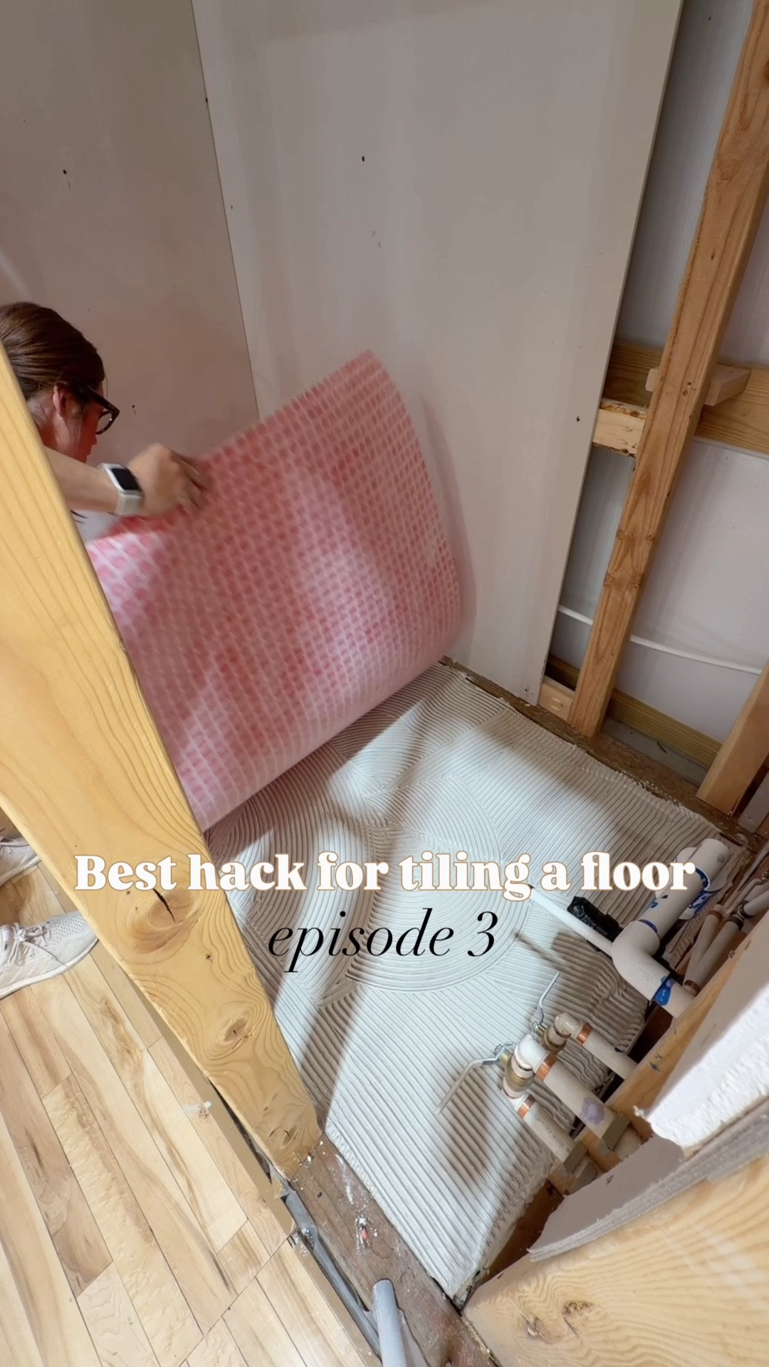 Creating a floor template will save you so much time and headache.  I’m using drywall shims & tape but you could also use strips of cardboard or plastic with hot glue.  Outline around the edges as well as the toilet drain.   Plan your layout so the toilet drain can be cut out of two tiles along a grout line vs smack dab in the middle of a tile for easy cutting on a saw  Use self leveling spacers to help eliminate any lips that can stub a toe. 

Check your tile size & notched trowel to make sure you are using the correct one (it says on the box!). Bigger tiles need a larger towel. 

Red thing is G-flex uncoupling membrane which helps protect against cracks, movement with settling, and waterproofing. 

SAVE this for your future tile projects!