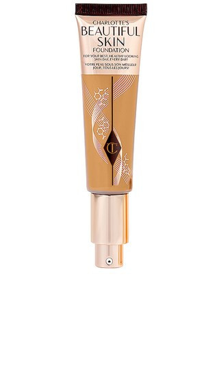 Charlotte Tilbury Charlotte's Beautiful Skin Medium Coverage Liquid Foundation with Hyaluronic Acid in 9 Warm. | Revolve Clothing (Global)