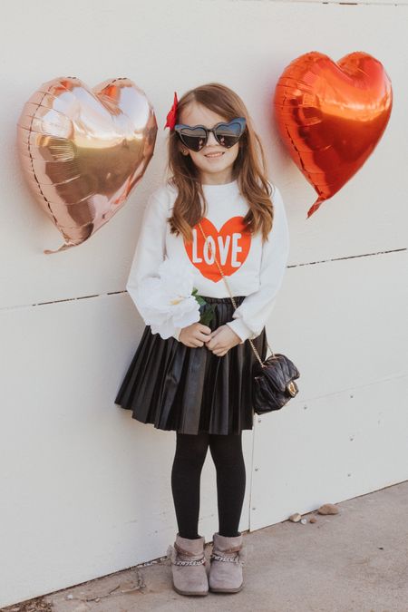 Girl’s Love Sweater. It fits more like a top. It’s perfect for all seasons because it is not hot in the inside. Girl’s faux leather pleated skirt. Mini girl’s purse adorable and only $16.00!  These are Brynn’s favorite boots. They are from DSW and so comfortable! 

#LTKfamily #LTKkids #LTKunder50