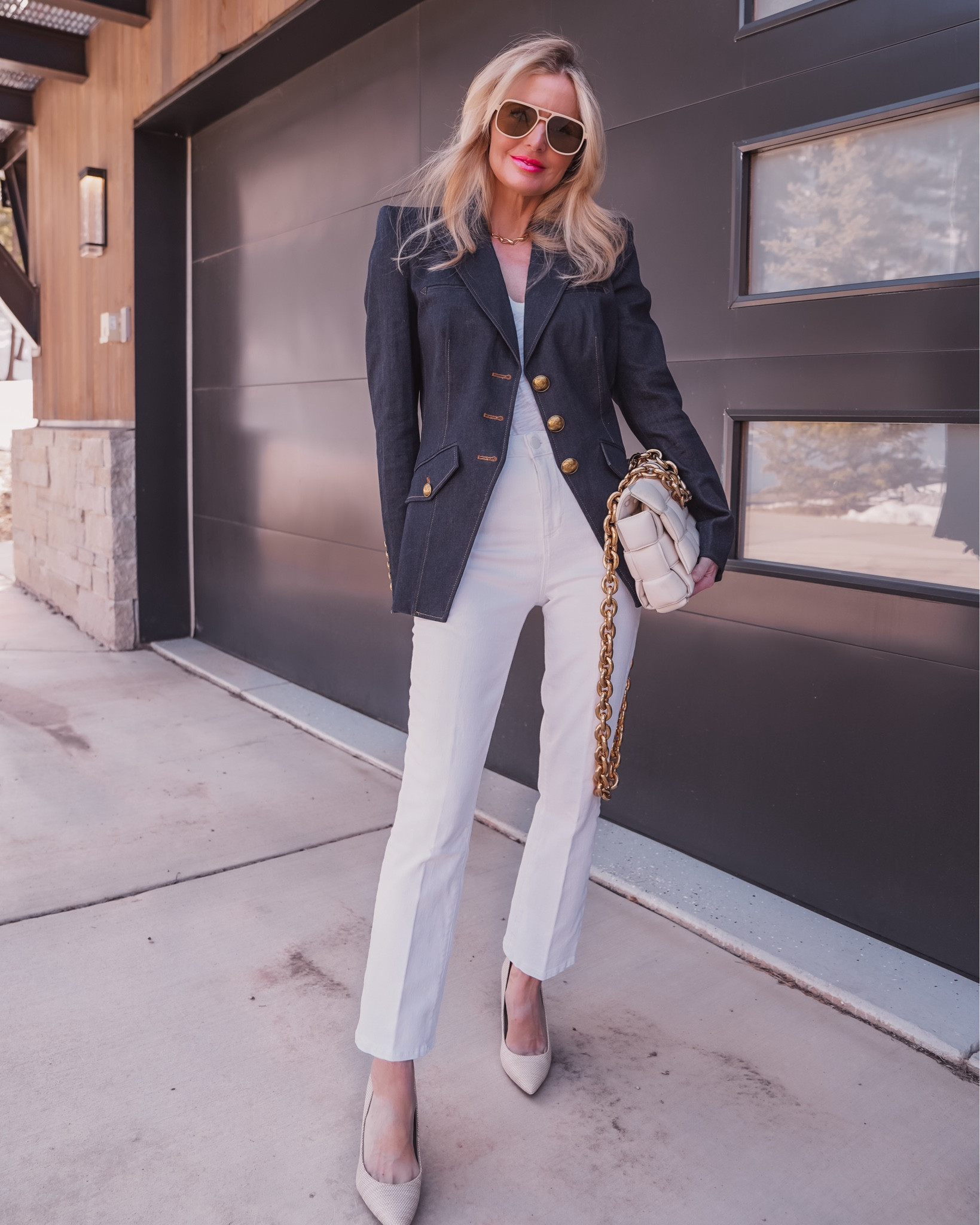 The power piece you didn’t know you needed, and now you won't stop thinking about it… is this gorgeous Veronica Beard denim blazer! And it’s currently on MAJOR sale!!!! 

The blazer is SO good because of its sophisticated details like the luxe gold buttons and structured, padded shoulders. The shoulders create width across the top, which in contrast with the tailored waist, gives the illusion of a smaller waist. The cotton blend fabric is thick enough to provide structure but is also quite breathable and lightweight for those who run hot. Since this blazer is denim, you can style it multiple ways: casually for lunch or dress it up for work or dinner.

In this look, I styled the blazer with one of my favorite basic white tees by ATM, a pair of cropped white jeans by L’Agence, and some neutral Sam Edelman pumps. Pairing the blazer with whites and light neutrals like this feels so fresh and springy. 

I completed the look with some cool Le Specs aviator sunglasses and my beautiful Bottega Veneta cassette bag that I’ve owned for a few years. All of these pieces run true to size.

~Erin xo 

#LTKSeasonal #LTKworkwear #LTKsalealert