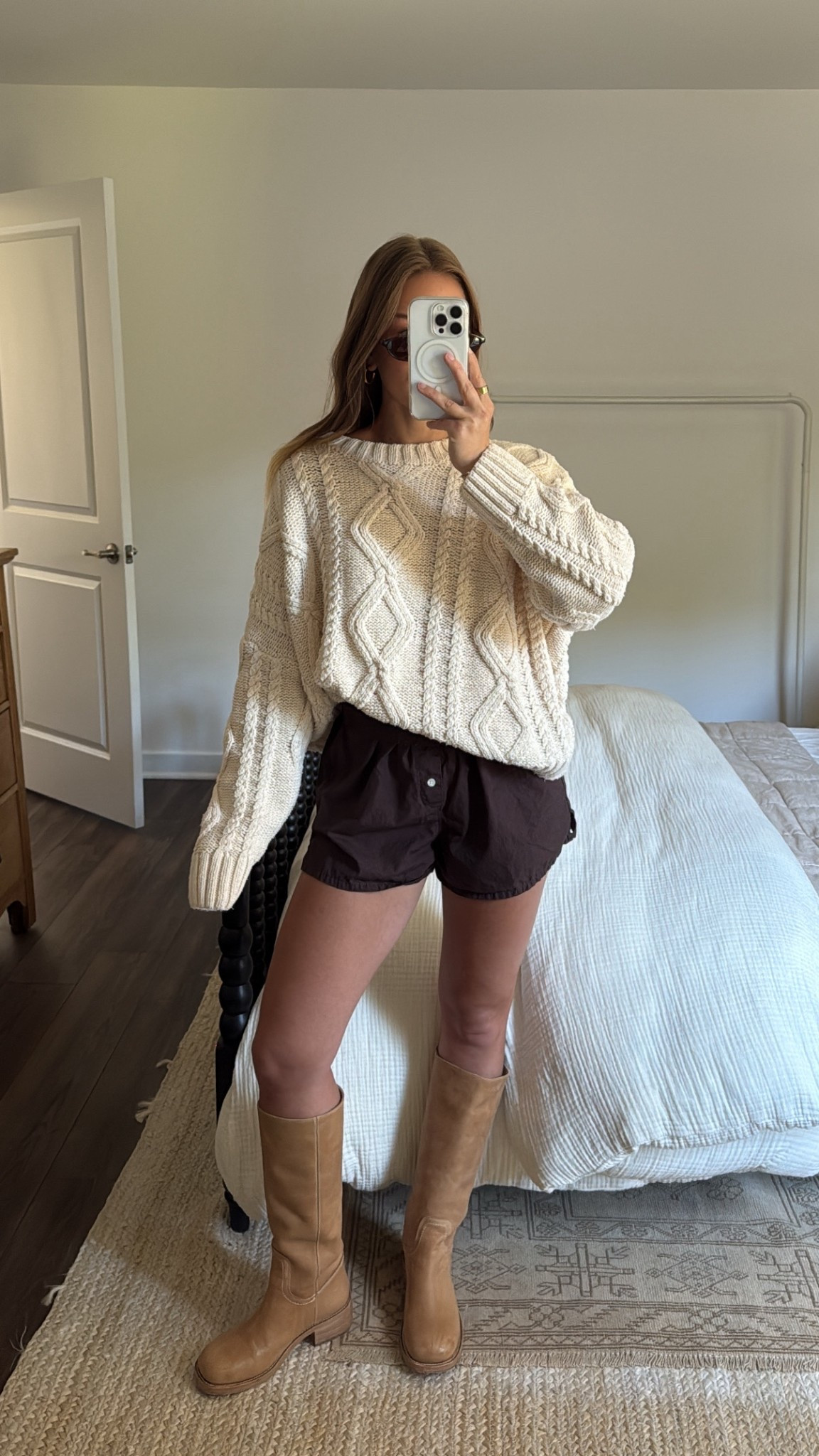 8/26/25 The perfect summer → fall outfit for a 70° day 🍂🤍 Wearing my oversized cable knit sweater from Princess Polly with my Aritzia brown boxer shorts + my Frye-inspired boots from Steve Madden. Cozy on top, easy + breezy on the bottom — my go-to transitional uniform.

#LTKStyleTip #LTKShoeCrush