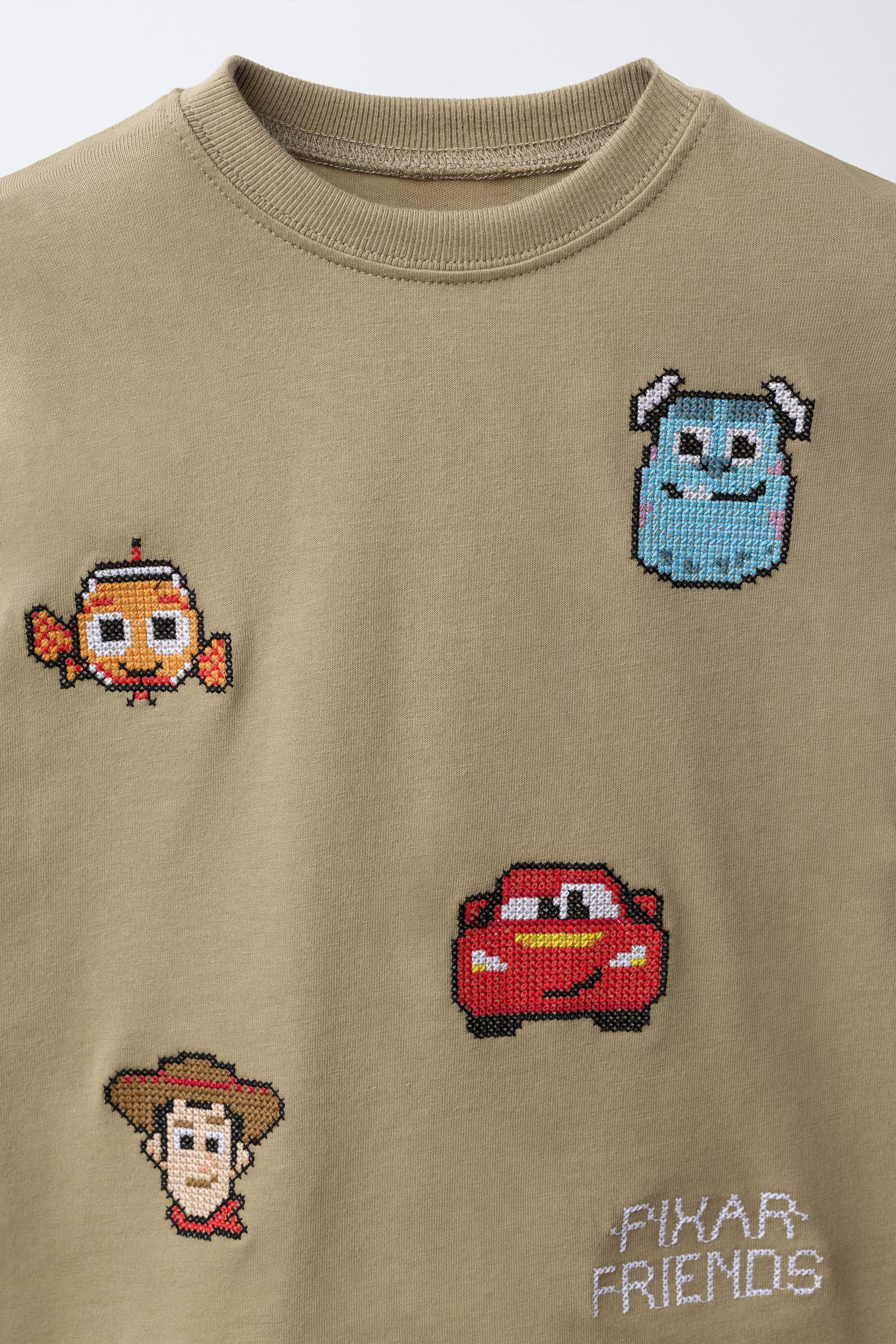 Round neck short sleeve T-shirt. Front cross-stitch embroidery \u00a9 Disney Pixar detail. | Zara US