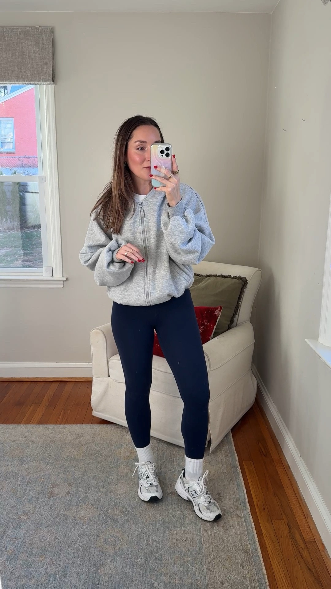 One of my all-time favorite hoodies! This looks so good with leggings and I love that the hem stays tucked under. Wearing small.