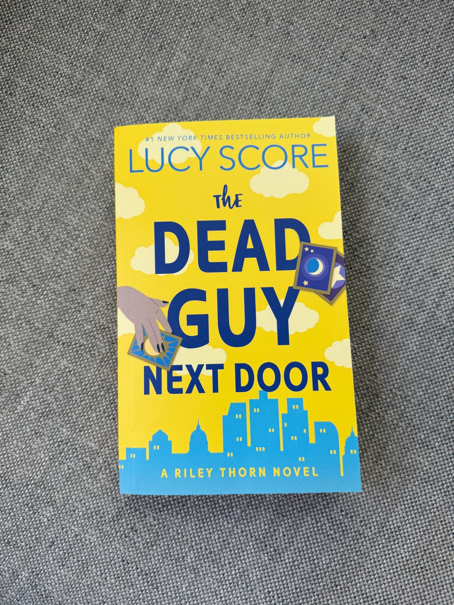 The Dead Guy Next Door by Lucy Score 
