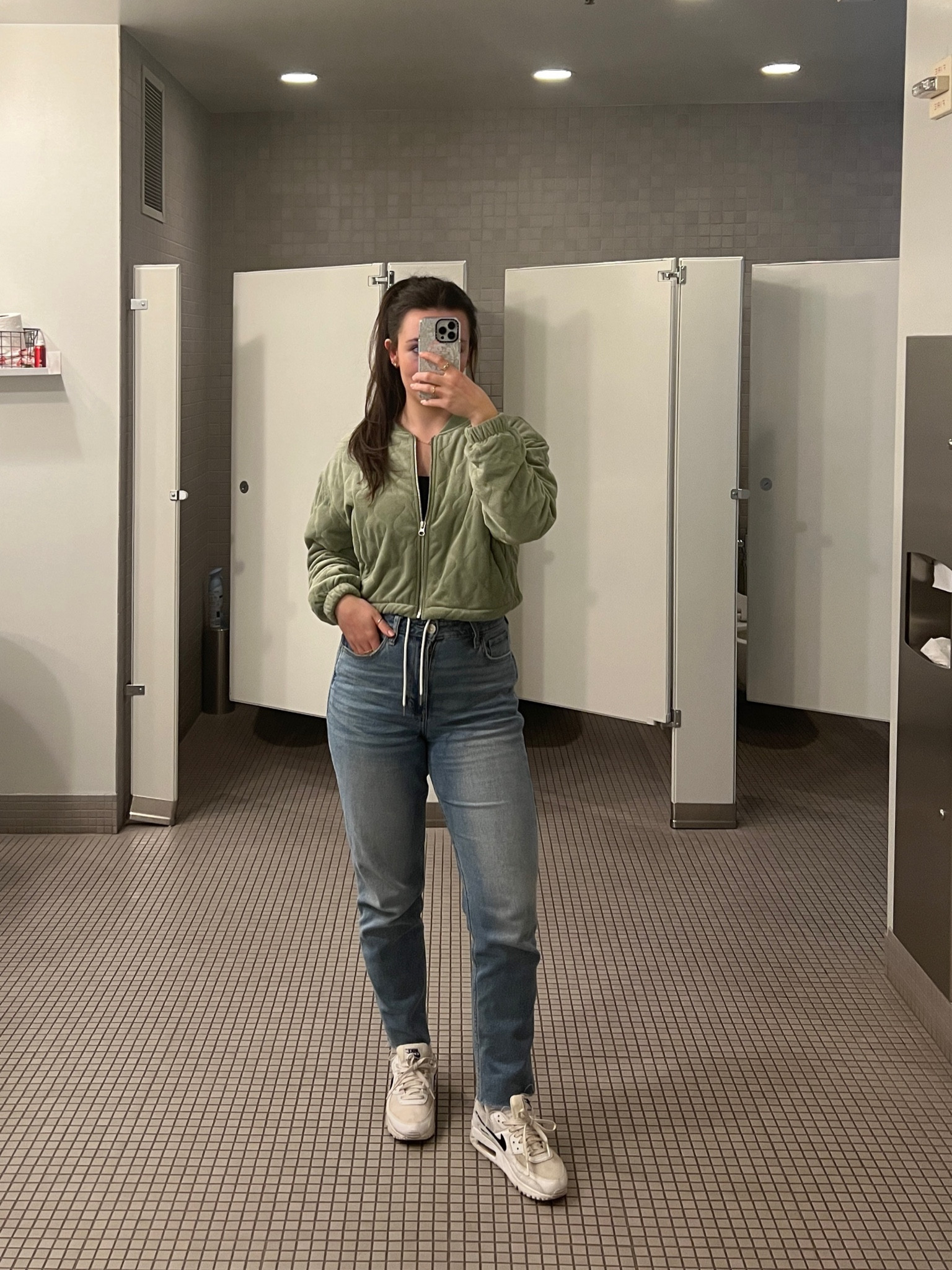 Green quilted cropped Nike jacket, straight leg jeans, Nike air max

#LTKfindsunder100 #LTKfitness #LTKSeasonal