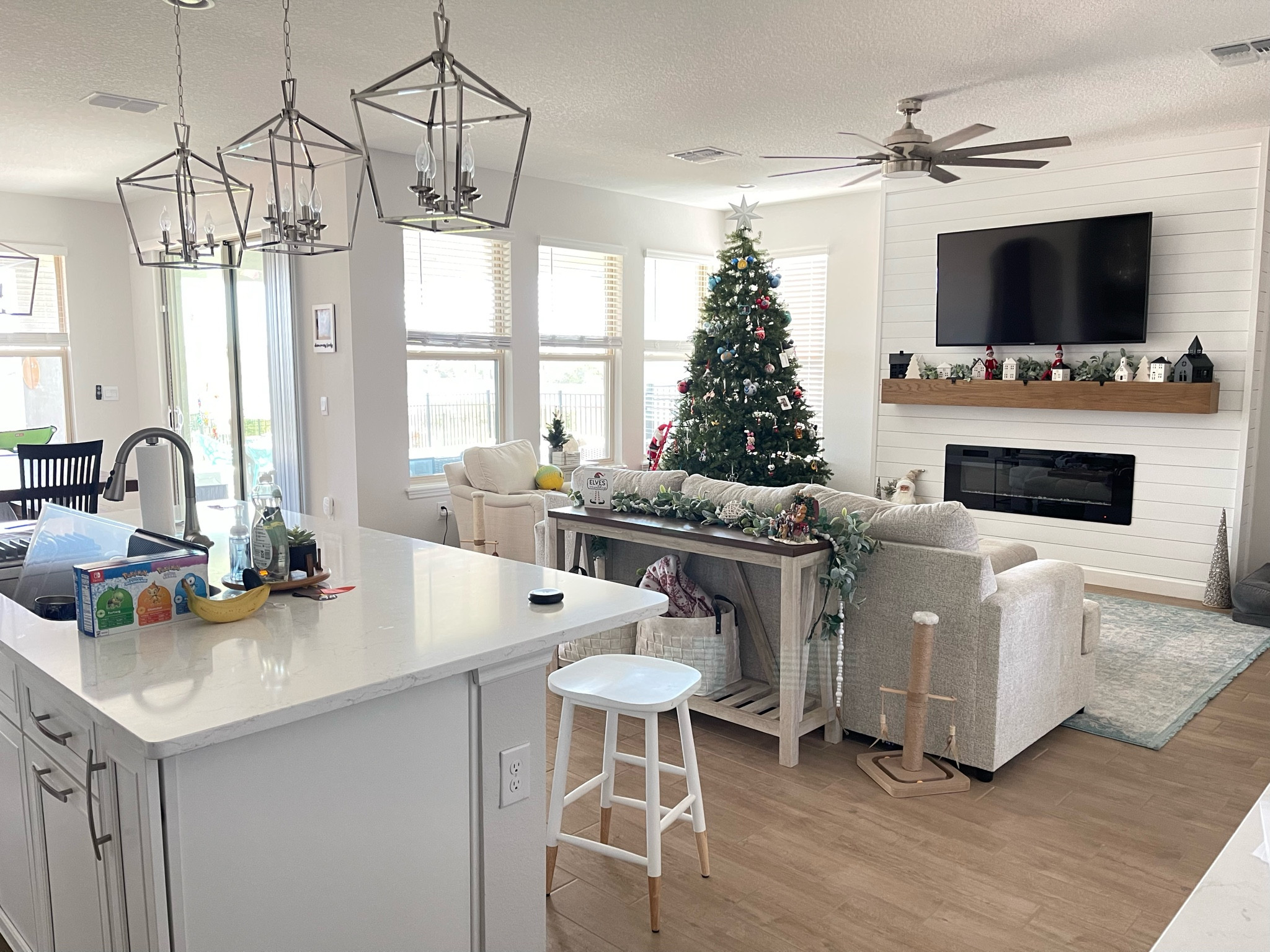 Where comfort meets chic – my family room is all set for holiday cheer and cozy evenings! 🎄✨ Love these festive touches? Swipe up to shop the look, from the twinkling tree to the snuggly throws, and yes, even that adorable cat tree. Here's to making memories in style! 