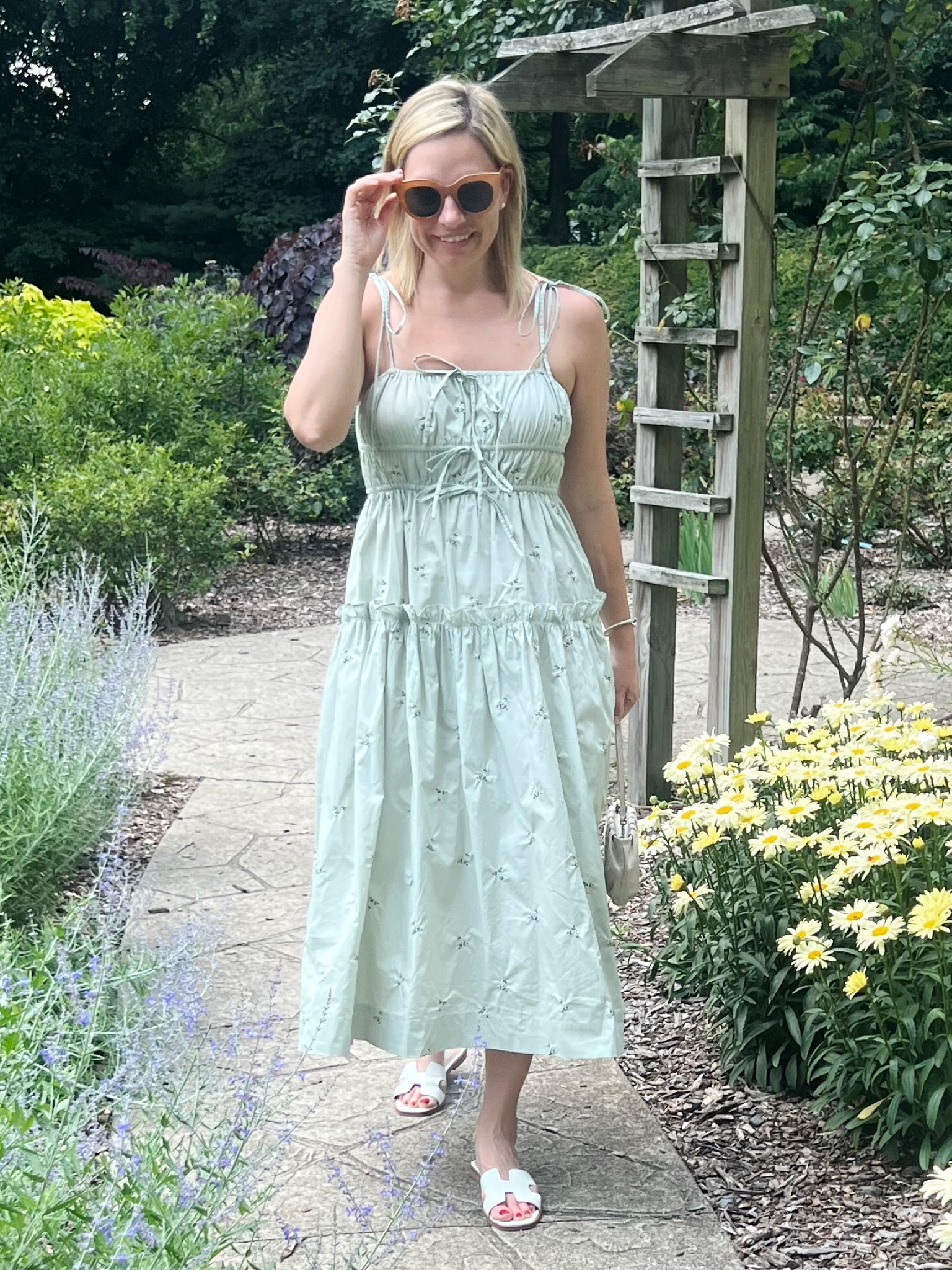 Green smock dress with tie straps. Floral smock midi dress. Tan oversized sunglasses. White slide sandals. White baguette mini bag. Summer fashion. Summer dress. 
.
.
.
.
… 

#LTKtravel #LTKstyletip #LTKSeasonal