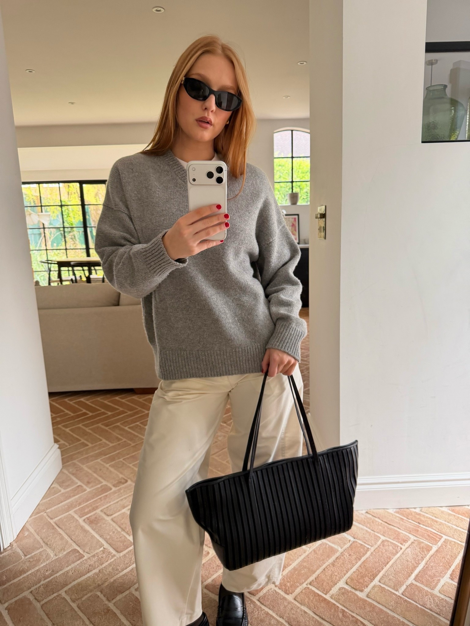 Kendall Jenner’s casual OOTD 🤍

grey v neck sweater, grey knit jumper, oversized v neck knitwear, cream wide leg trousers, ecru wide leg trousers, black tote bag, pleated tote bag, black structured tote, black loafers, black leather loafers, flat loafers, smart casual outfit, autumn winter outfit, neutral outfit, minimalist style, office outfit, work wear, quiet luxury, old money aesthetic, cream trousers outfit, grey and cream outfit

#LTKworkwear #LTKeurope #LTKsummer