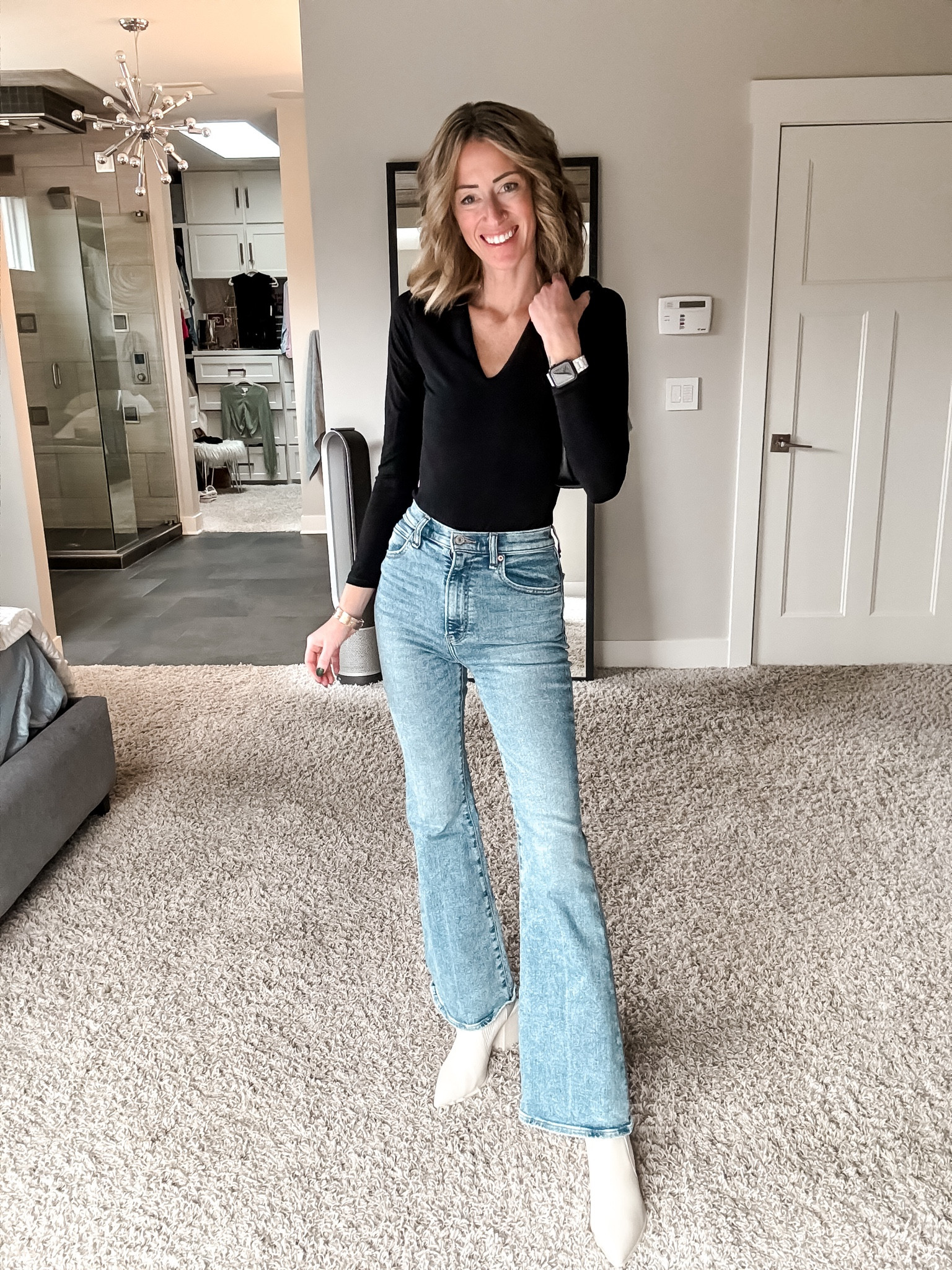 Black bodysuit pumiey Amazon fashion finds prime shipping and flare jeans Abercrombie winter outfit ideas  