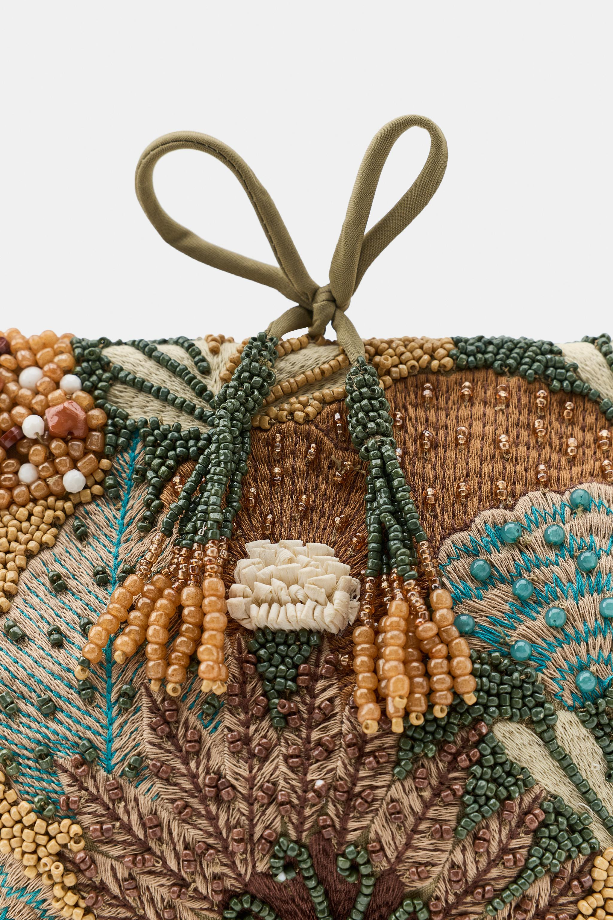 Model height: 183 cmFabric clutch bag. Features appliqu\u00e9 and embroidery detailing on the bod... | Zara UK