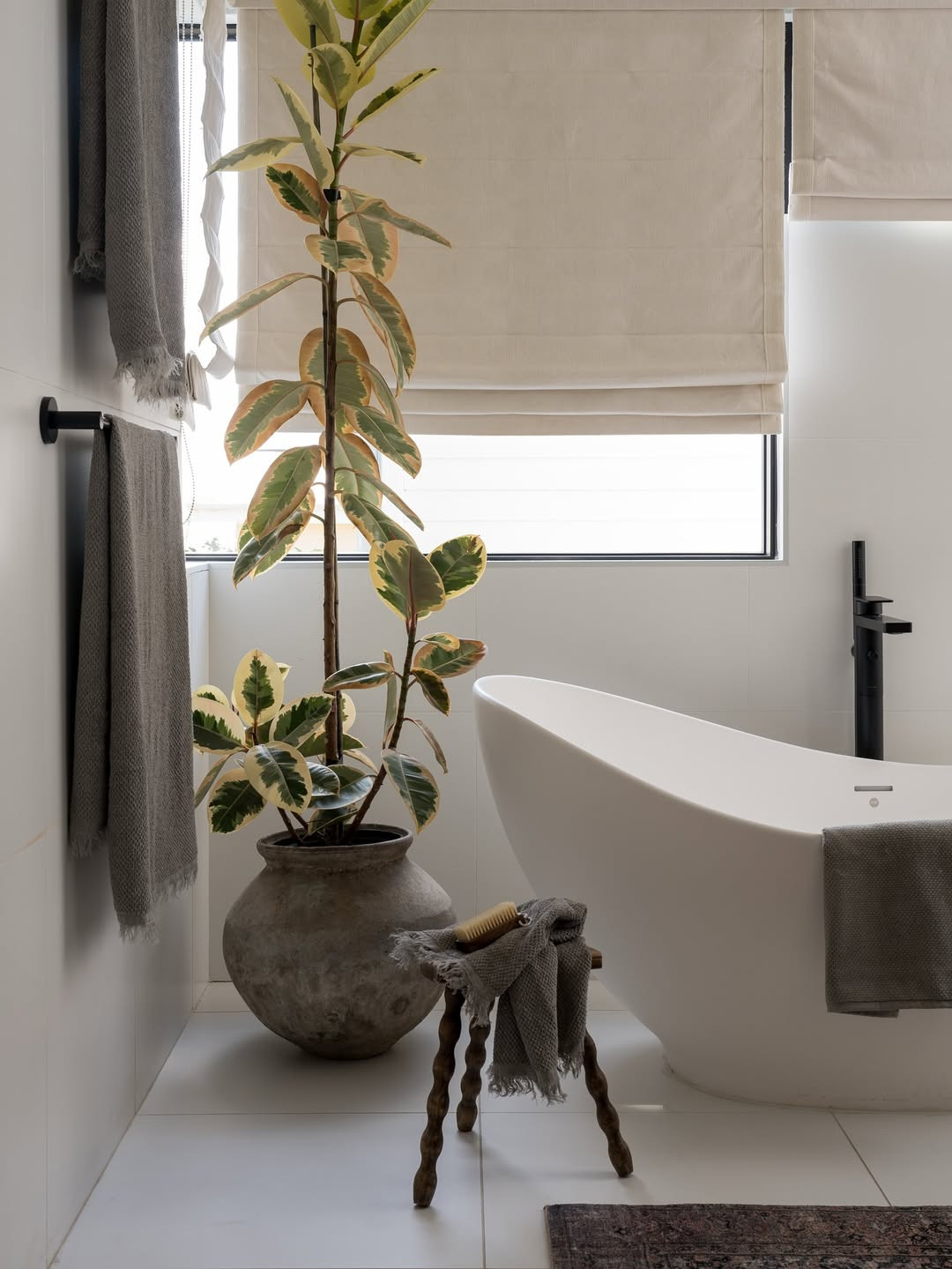 Collected details and elevated function—this bathroom blends organic beauty with everyday ease. #BathroomInspo #CaliforniaCasual #LayeredBathroom 

 #LTKHome