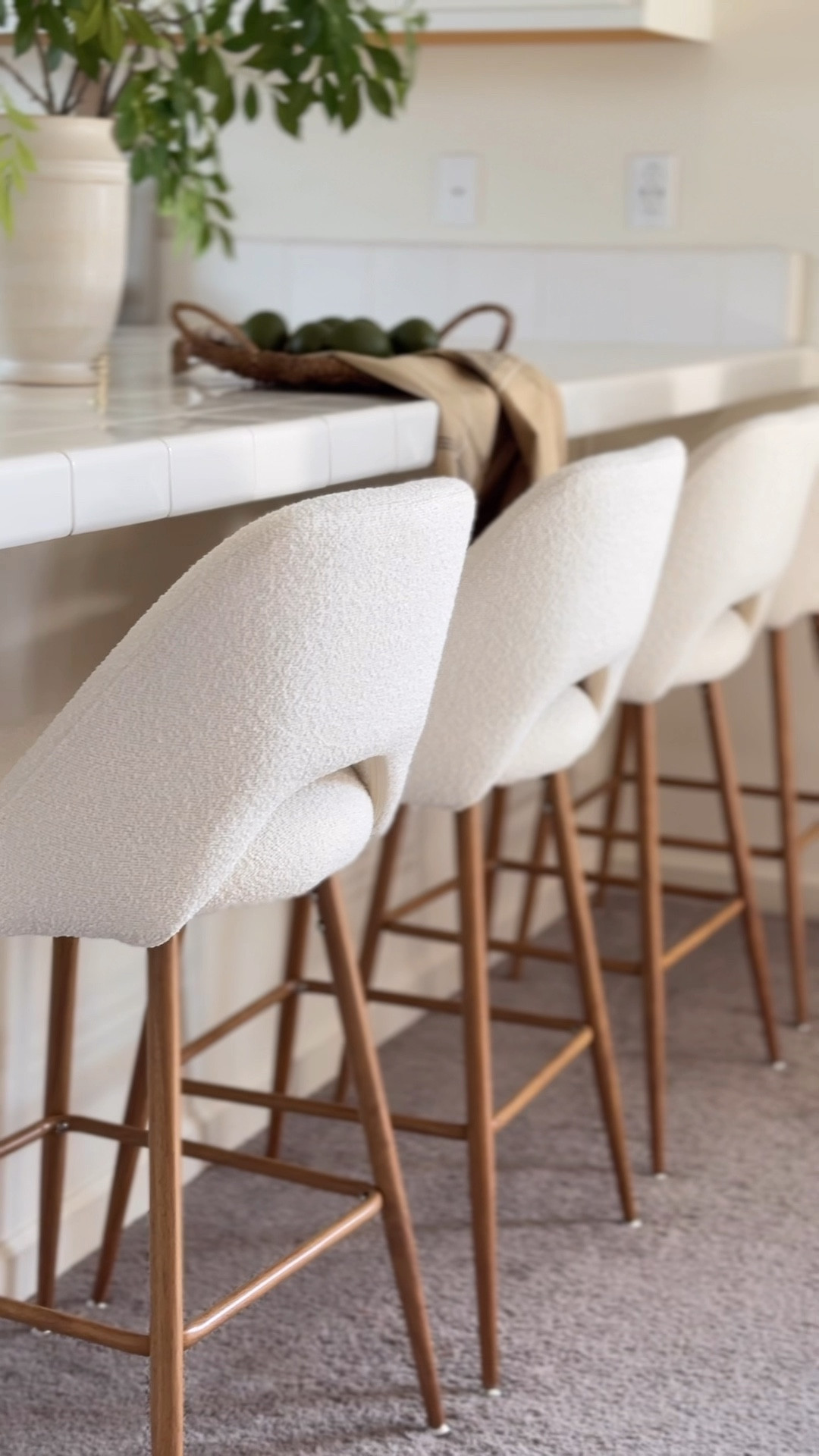 My new barstools are here! 
I’m so excited for this beautiful upgrade! If you have been following along, then you have seen the recent updates in our Dining Room makeover series! I recently added a gorgeous new White Oak Dining Table, new Dining Chairs, and this area would not be complete without new barstools!

Let’s talk design- When it comes to designing an area, especially in an open concept, you want to make sure the pieces flow together. The goal was to create a bright and airy and inviting space. I also wanted the dining furniture to be the main focal point and I did not want the barstools to compete with the dining furniture, so that is why I went with a natural oak frame and Boucle fabric barstool. The texture and tone complements the dining furniture for a more cohesive look, and I love that it features a low back, so that I can have a clear view when engaging in conversations across the room. I am so happy with the new and improved dining/kitchen area and 10/10 I highly recommend these barstools! 

What do you think? 👇🏼


#LTKHome #LTKStyleTip #LTKFamily