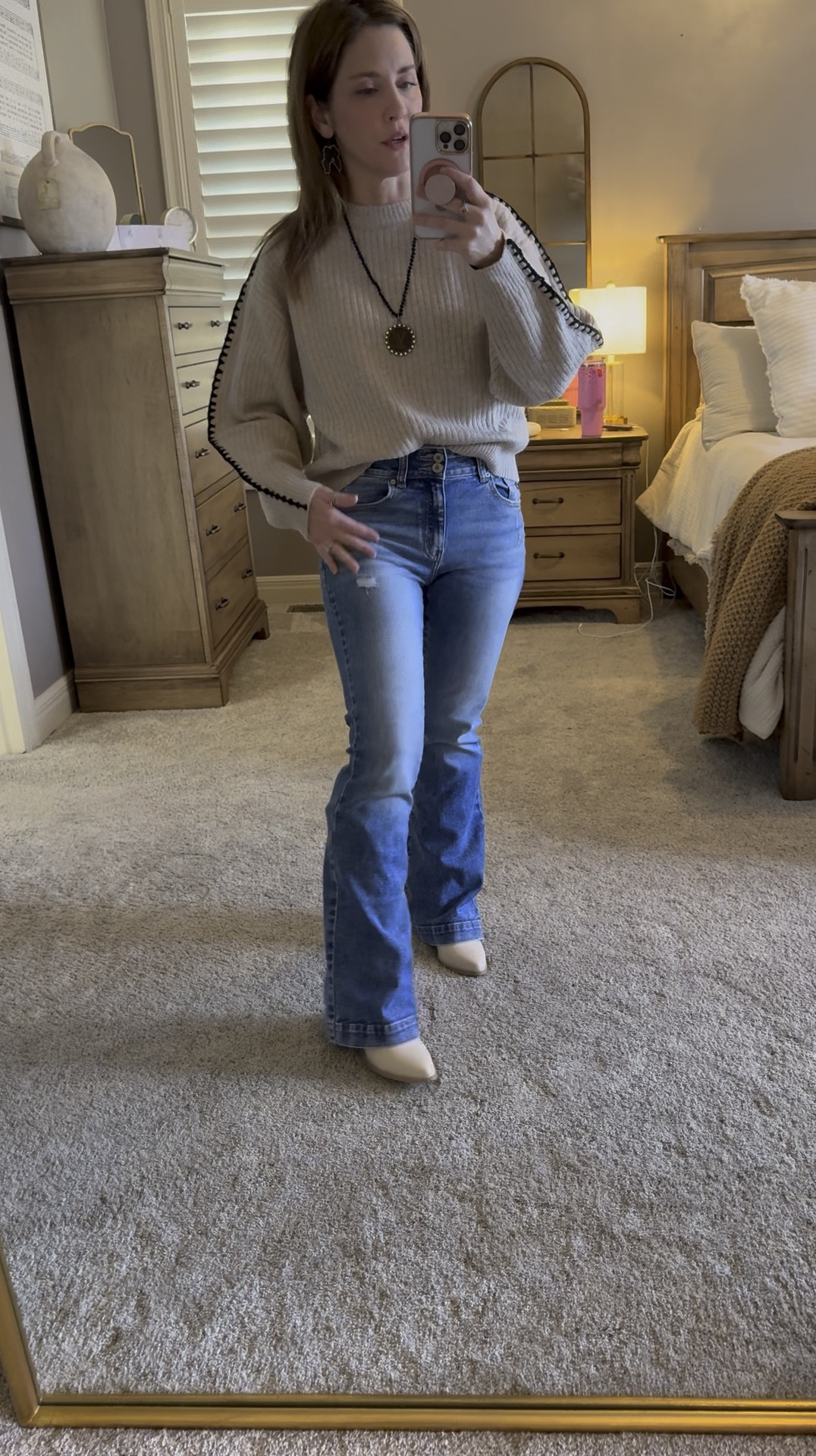 Cozy comfortable look! Wearing an XS sweater is a bit oversized. 

Jeans come in short regular and long length. I have on regular length size 25 