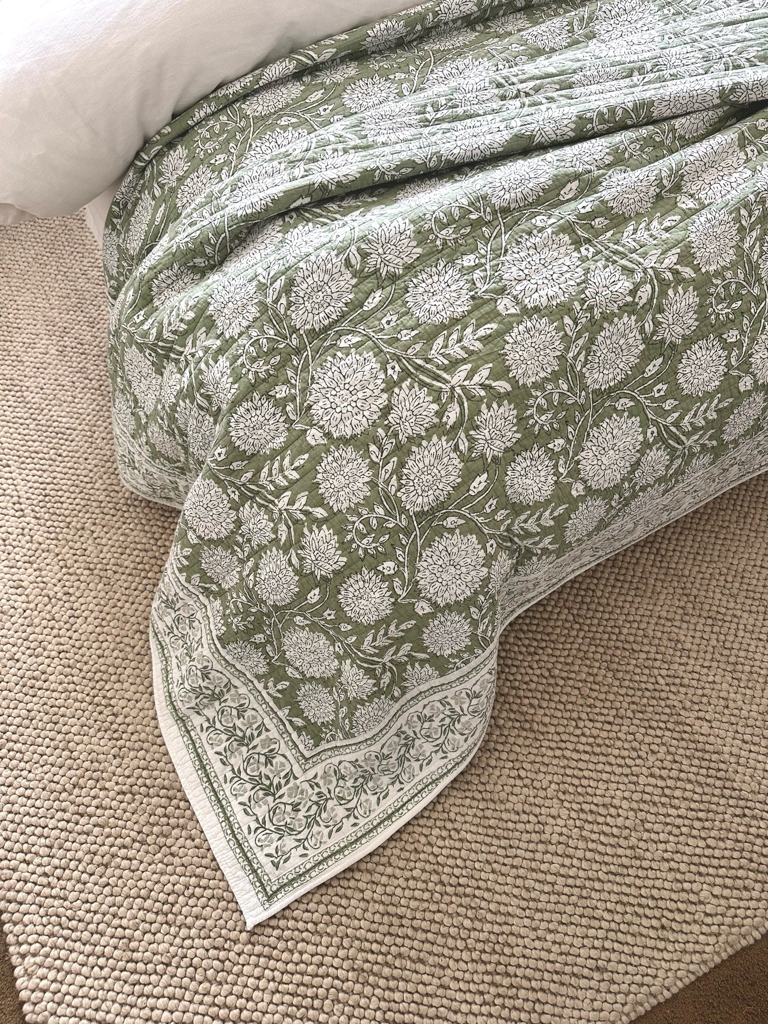Pottery Barn look for less! This floral quilt is stunning! Amazon + multiple colors! This is the sage color.

I did a king size quilt on our queen bed so it would drape over the sides better. If you do a king quilt like I did it will come with king shams. I cut the detailed edge off of the shams and sewed them so my queen shams would fit inside. Just an FYI.

This rug I’ve had for over a month and it’s probably my most favorite rug I’ve ever owned. It’s neutral, natural and holding up very well.

Floral quilts, green bedding, spring bedding, rugs, bedroom design, bedroom ideas, home decor, home design, design inspiration