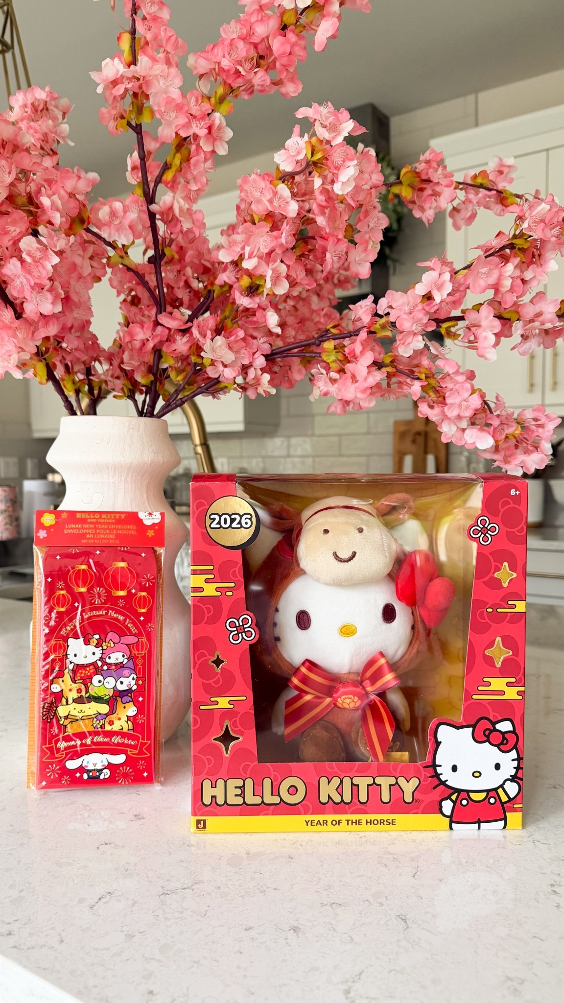 Chinese Lunar New Year Tet Year of the Horse Hello Kitty plushie with faux cherry blossoms 

#LTKKids #LTKSeasonal #LTKHome
