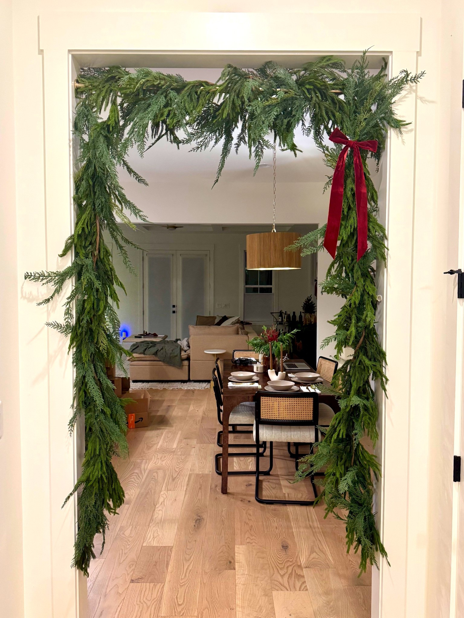 Shower rod garland doorway hack! I used 4 garlands total for this... wrapped 1 of each kind together to make 2 thicker garlands. 

#LTKFindsUnder50 #LTKHoliday #LTKHome
