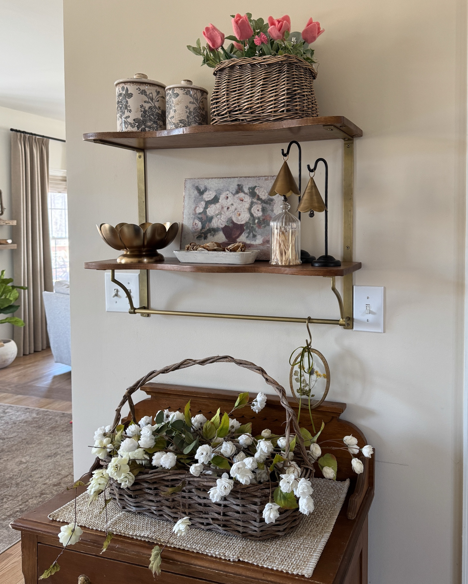 Wall shelf with spring decor ~

Adorable pink felt tulips
Oval glass pressed floral ornament
Faux hops (shown in long basket)
Standing scalloped bells
Canvas flower wall art (set of 2)
Distressed canister
Clear glass cloche match holder
Similar wall shelf
Similar baskets 
