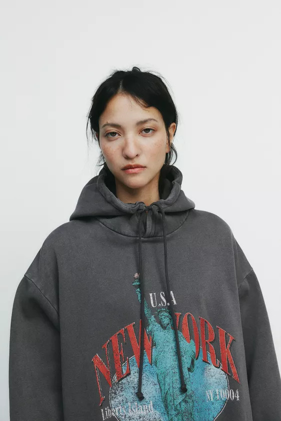Washed-effect sweatshirt. Hooded neckline and long sleeves. Ribbed trims. Contrast text and print... | Zara UK