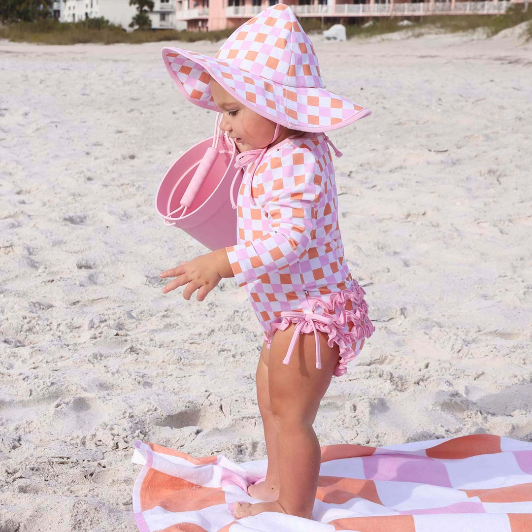 Long Sleeve Rash Guard With Ruffle Bottom | Check Me Out | Caden Lane