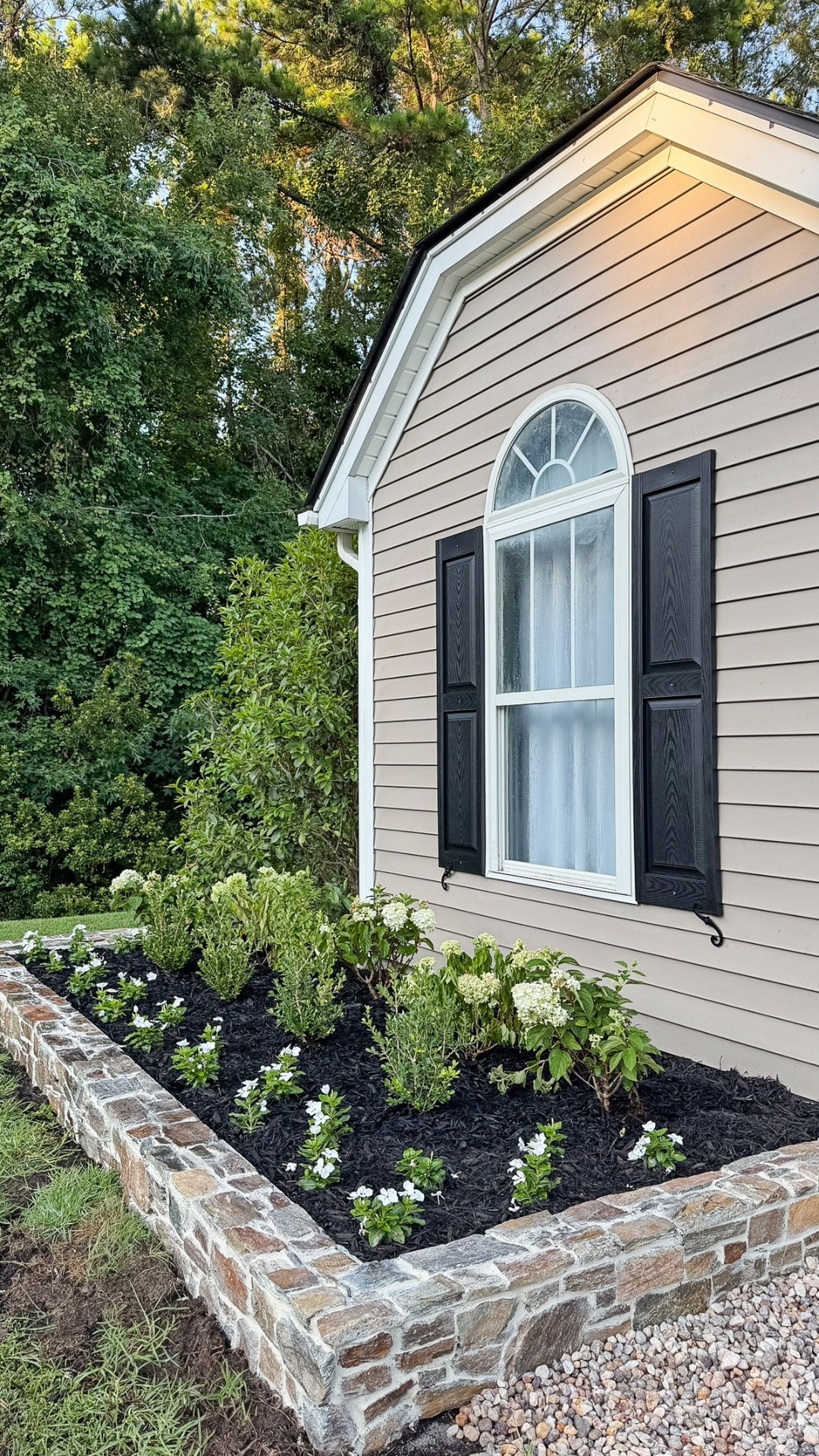 A much needed garden makeover! The stone garden wall is my favorite part, which was inspired by @kristinanevans beautiful stone garden beds! It has really elevated our exterior.

#LTKHome #LTKvlog #LTKdayinmylife