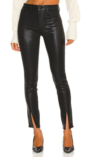 Jyothi High Rise Split Ankle Jeans in Noir Coated | Revolve Clothing (Global)