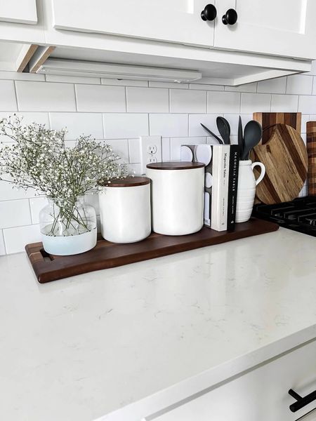 Simple kitchen styling with wood boards, ceramic canisters, and baby’s breath  

#LTKfindsunder100 #LTKhome #LTKstyletip