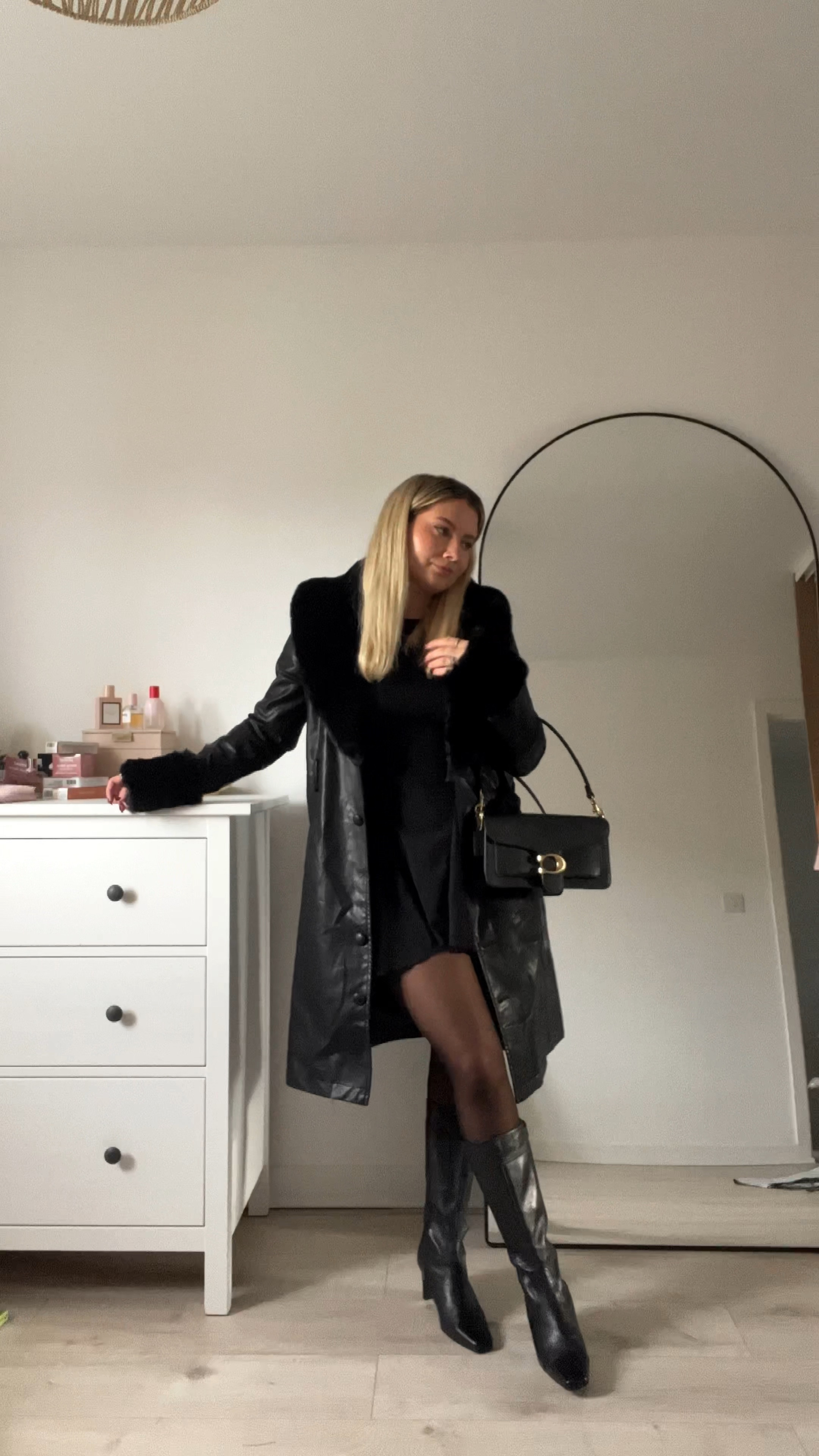 an all black date night outfit featuring a black mini skater flowy dress with long sleeves, black knee high square toe boots, black faux fur trim long belted coat and a coach tabby shoulder bag 🖤

#LTKsalealert #LTKstyletip #LTKeurope