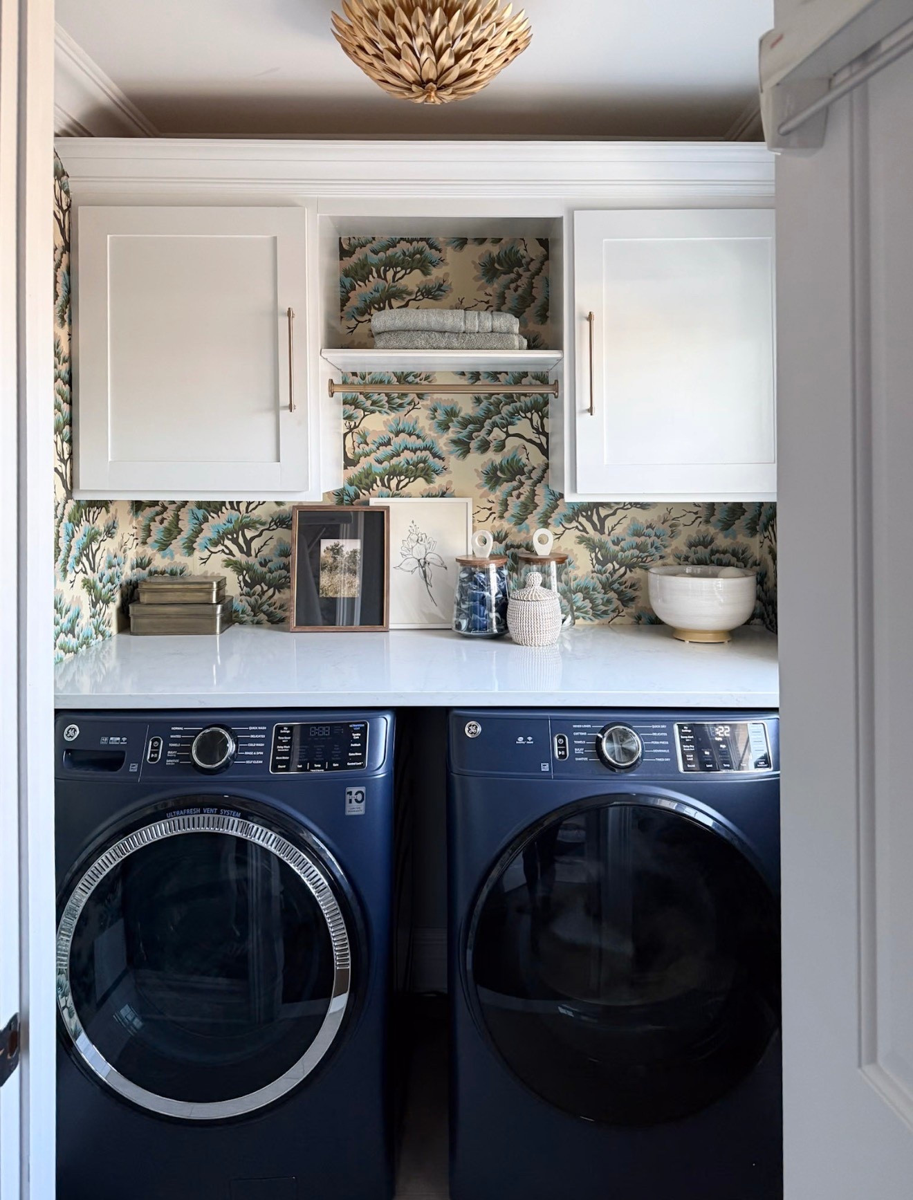 I love the bold wallpaper that we chose for our laundry room! Smaller rooms are perfect spaces to experiment with a darker or moodier wallpaper — have fun with the pattern and design! 

#LTKdayinmylife #LTKHome #LTKSaleAlert