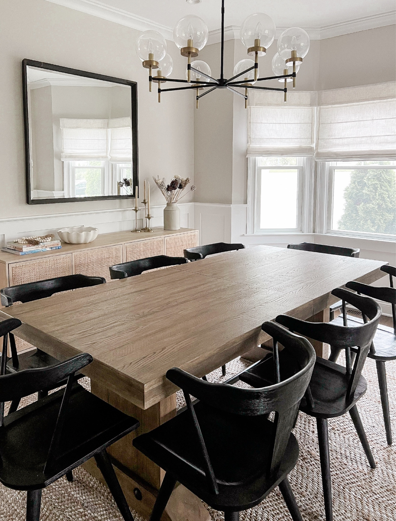 One of my favorite dining rooms! We kept things neutral but added interest through texture (a natural fiber and leather rug, linen shades, a woven buffet, and mixed metals) 🙌🏻

#LTKHome #LTKSaleAlert #LTKStyleTip