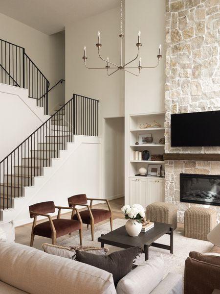 Living room inspo with a lot texture & organic touches! 

pillows, living room inspo, texture, velvet accent chairs, linen sofa, slipcover sofa, built in styling, stone fireplace, ottomans, coffee table, dark coffee table, vase, florals, faux stems coffee table styling, pillow styling, iron stairway 


#LTKHome #LTKSaleAlert #LTKStyleTip
