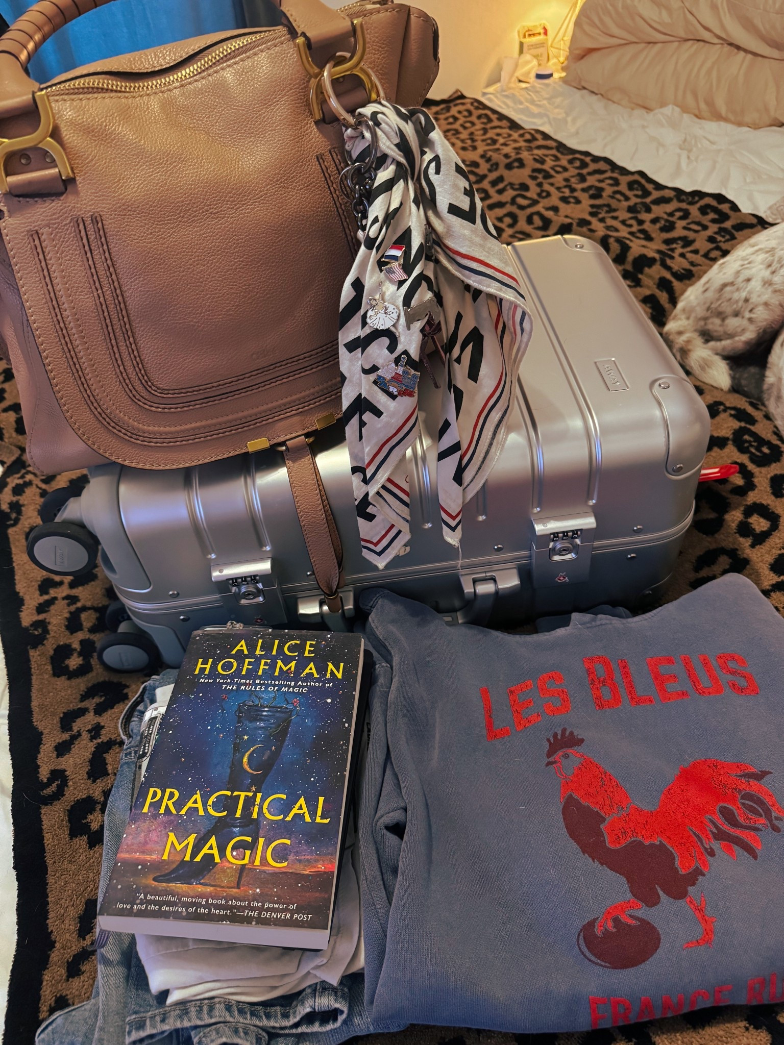Preparing for a short road trip and weekend away! Of course I had to pull out my trusty Away Carry-On in silver aluminum and using my new to me Chloe Marcie bag (bought on FASHIONPHILE, this lady is from 2011!) I always want to be comfortable so will be representing Les Bleus with my sweatshirt. #travel 

#LTKStyleTip #LTKTravel #LTKItBag