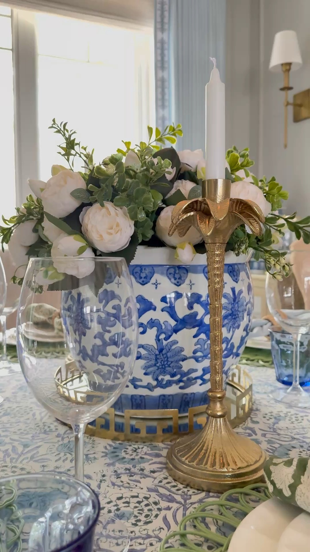 Chic and pretty dining room and tablescape! See the scene with gorgeous block prints, bamboo flatware, colorful glasses and more!