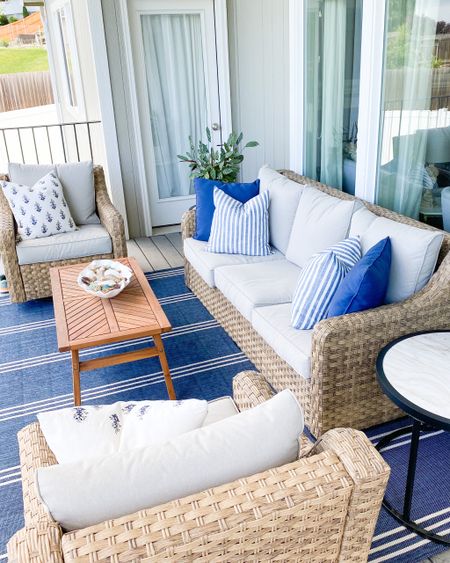 Outdoor patio. My patio. Traditional patio. Patio couch set. Patio sofa set. Swivel arm chair outdoor. Blue and white striped outdoor rug. Traditional outdoor rug. Outdoor wood coffee table. Faux marble top side table. Neutral outdoor patio set. Jennuinehome. Jennuine home. Shell bowl decor outdoor  