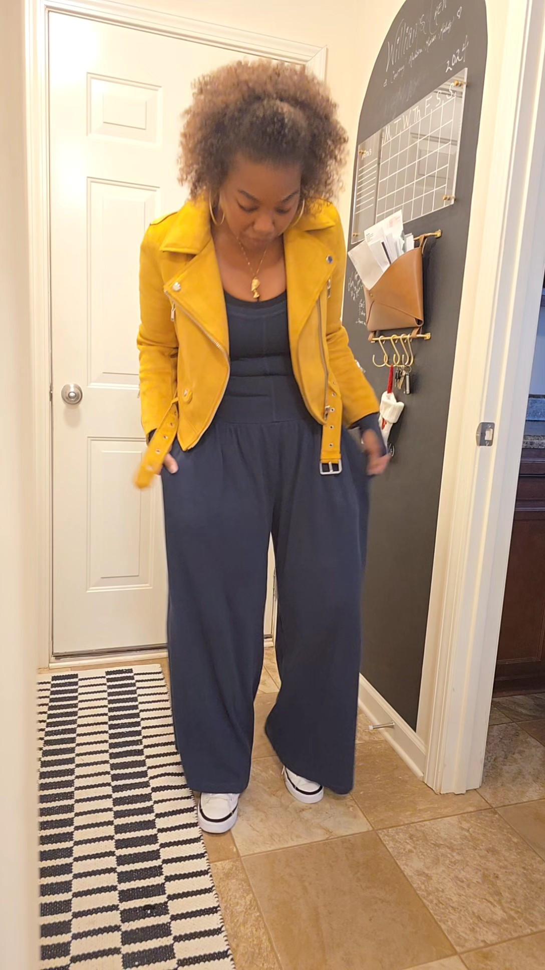 Easy outfit formula for the days you want to look put together without doing too much. A wide leg jumpsuit, statement jacket, and sneakers will always work. Comfortable, casual, and still cute enough for brunch, errands, travel days, or a casual date night.Linked this casual wide leg jumpsuit, similar yellow moto jacket, everyday sneakers, and easy layered look details on my LTK.Keywords: casual outfit ideas, wide leg jumpsuit, everyday fashion, casual chic style, comfortable fashion, effortless outfits, mom style, travel outfit, sneaker outfits, layered outfits, elevated casual look, black jumpsuit outfit, street style casual, wearable fashion, real life style, spring outfit ideas, fall transition outfit, lifestyle creator, women over 40 style

#LTKTravel #LTKOver40 #LTKootd