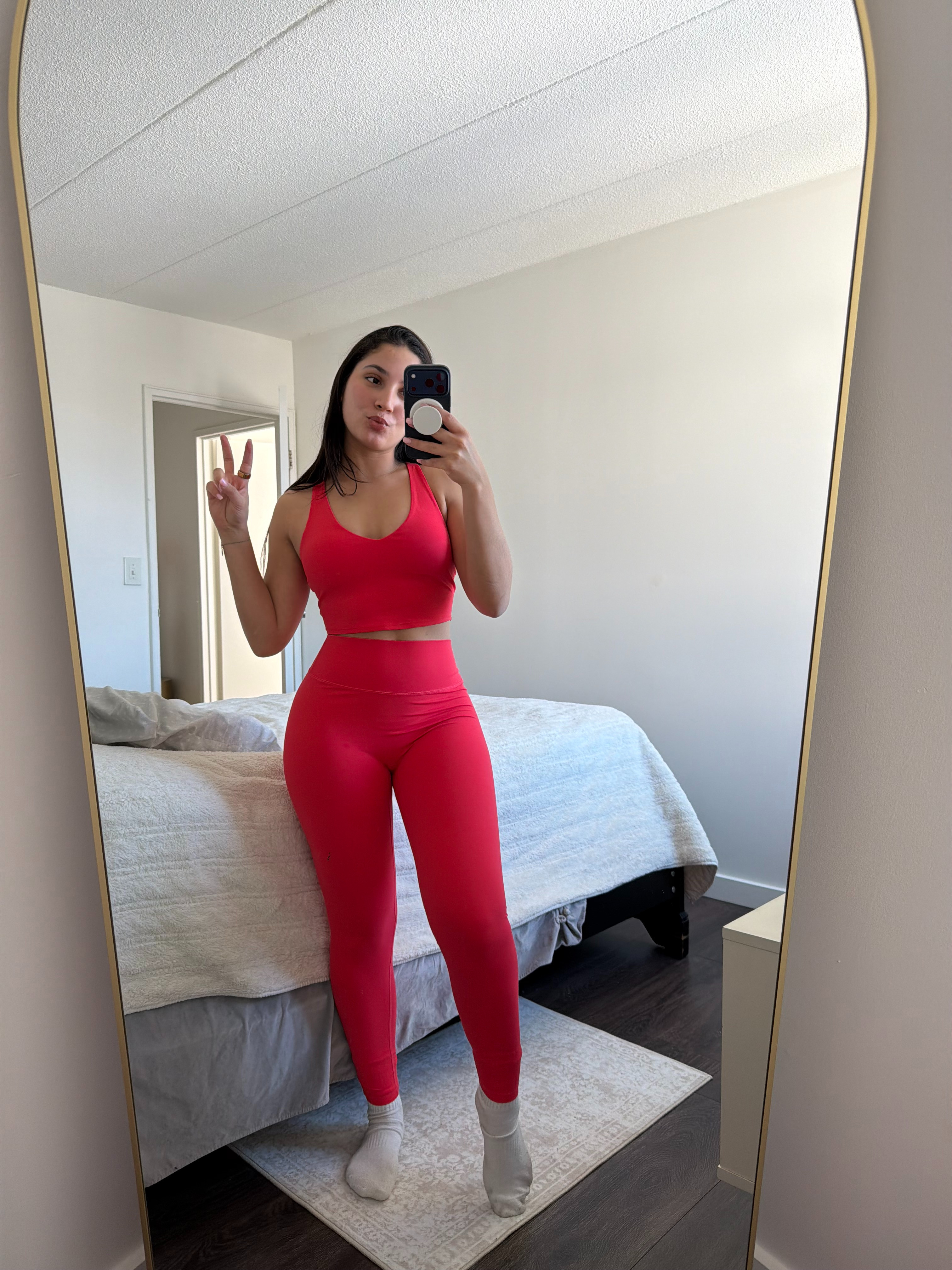 I'm 5'5" wearing size S in both the leggings and crop tank. The top has a built-in shelf bra, and the leggings have no front seam for a smooth fit. Love this vibrant hibiscus red for workouts or lounging. 

 #LTKootd #LTKfitnessgoals #LTKActive