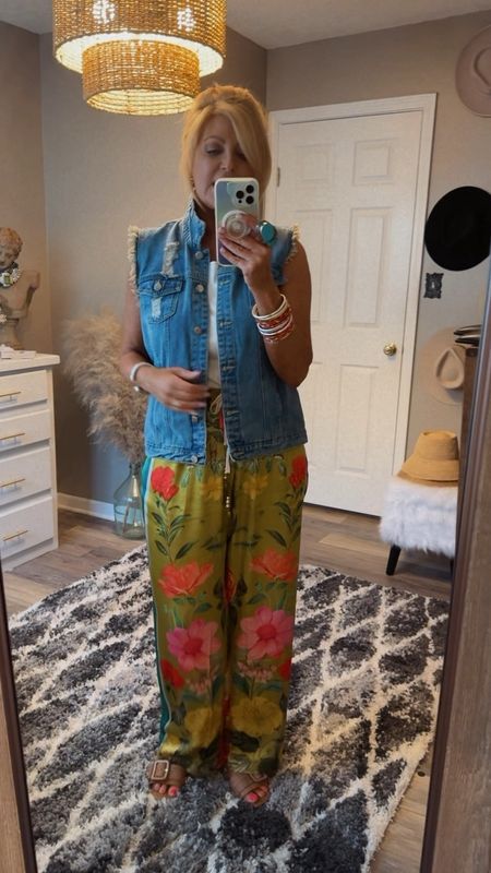 My denim vest is chefs 💋 & tts but I sized up to a large for a more oversized fit.  I sized down to a small in my pants because they run generous.  

#LTKshoecrush #LTKtravel #LTKstyletip