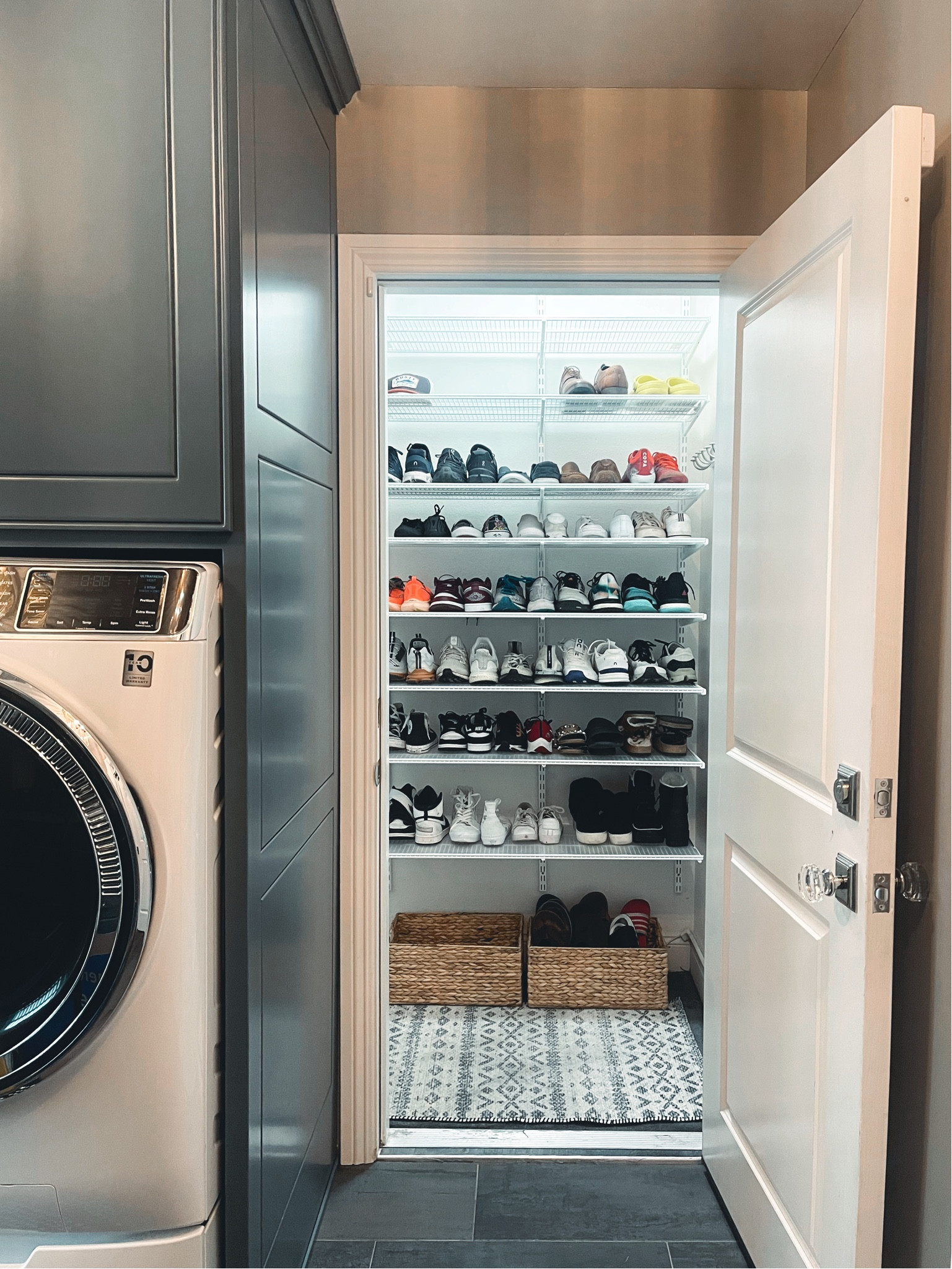 A simply organized garage mudroom wall 🤍 white shelving garage mudroom shoe storage

#LTKfamily #LTKhome