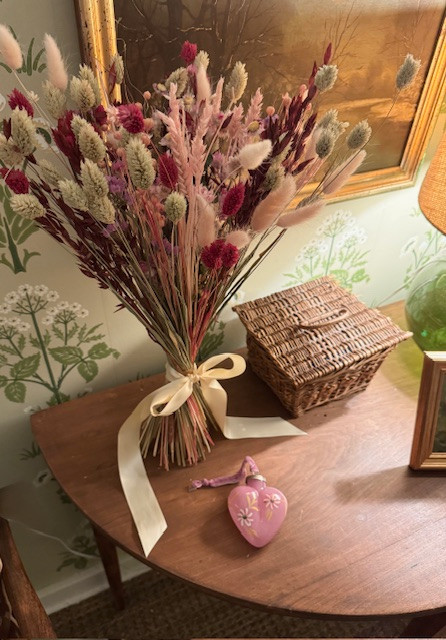A little Valentine color added to the foyer, by way of this bouquet of dried flowers in shades of pink and garnet, and a sweet hand-painted glass ornament. 

 #LTKValentine #LTKSeasonal #LTKHome