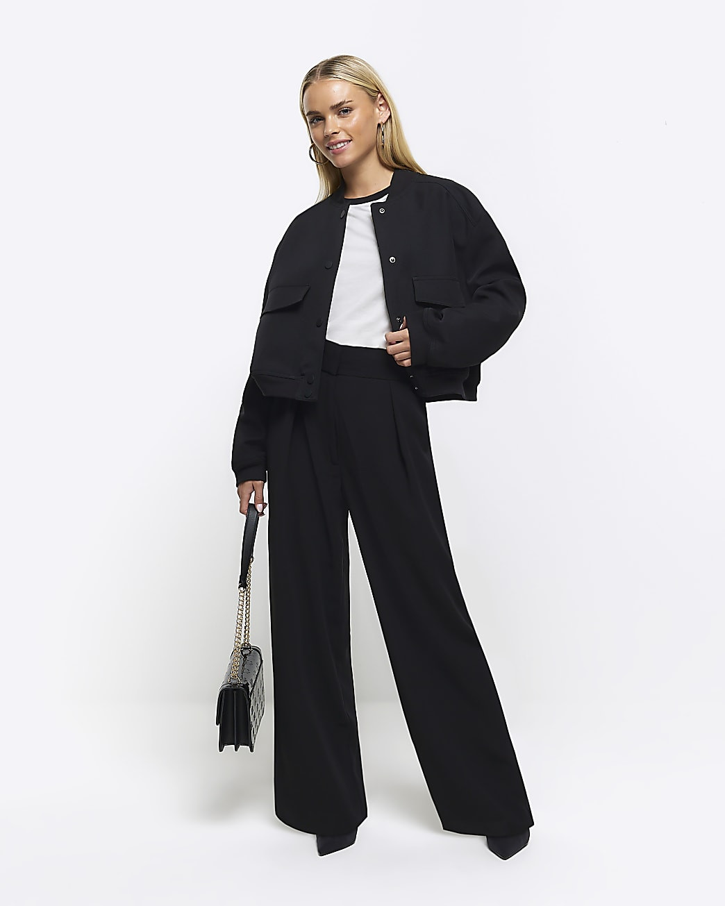 Petite black pleated wide leg trousers | River Island (UK & IE)