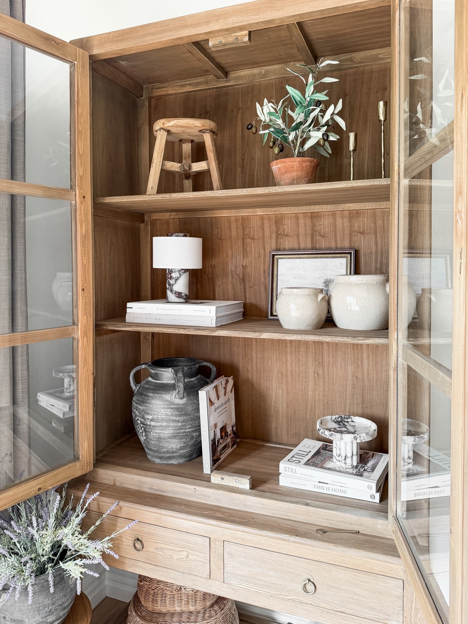 A little shelf styling moment 🤎 I love mixing old-looking pieces, books, warm wood, marble and a few imperfect pottery finds together. Nothing too matchy, just layers that make the whole cabinet feel collected over time.

#LTKsale #LTKfall #LTKhome