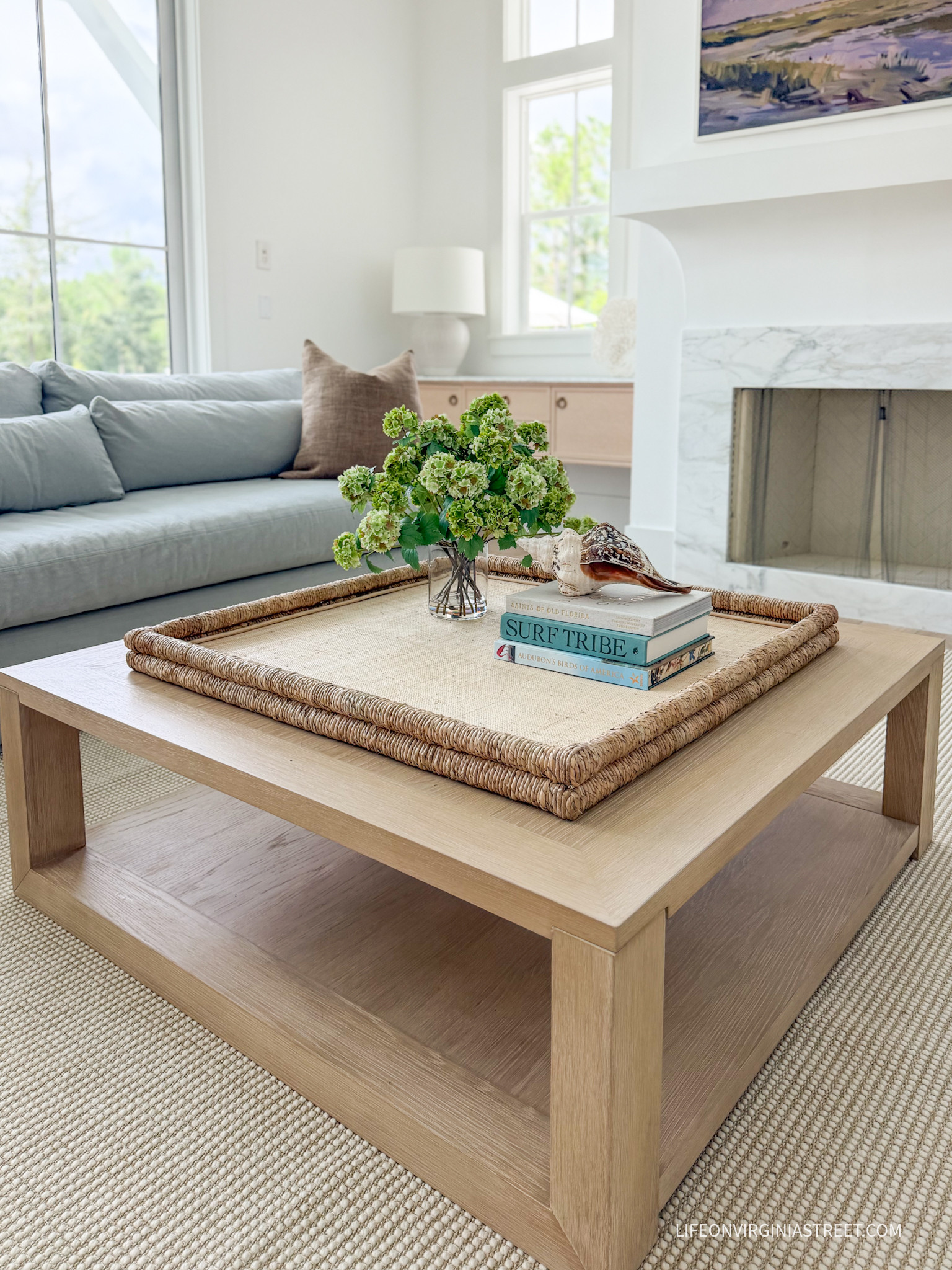 A peek in our new coastal living room! We love our light blue linen sofas, light wood coffee table, light wood and marble console table and more!

#LTKSeasonal #LTKHome #LTKSaleAlert