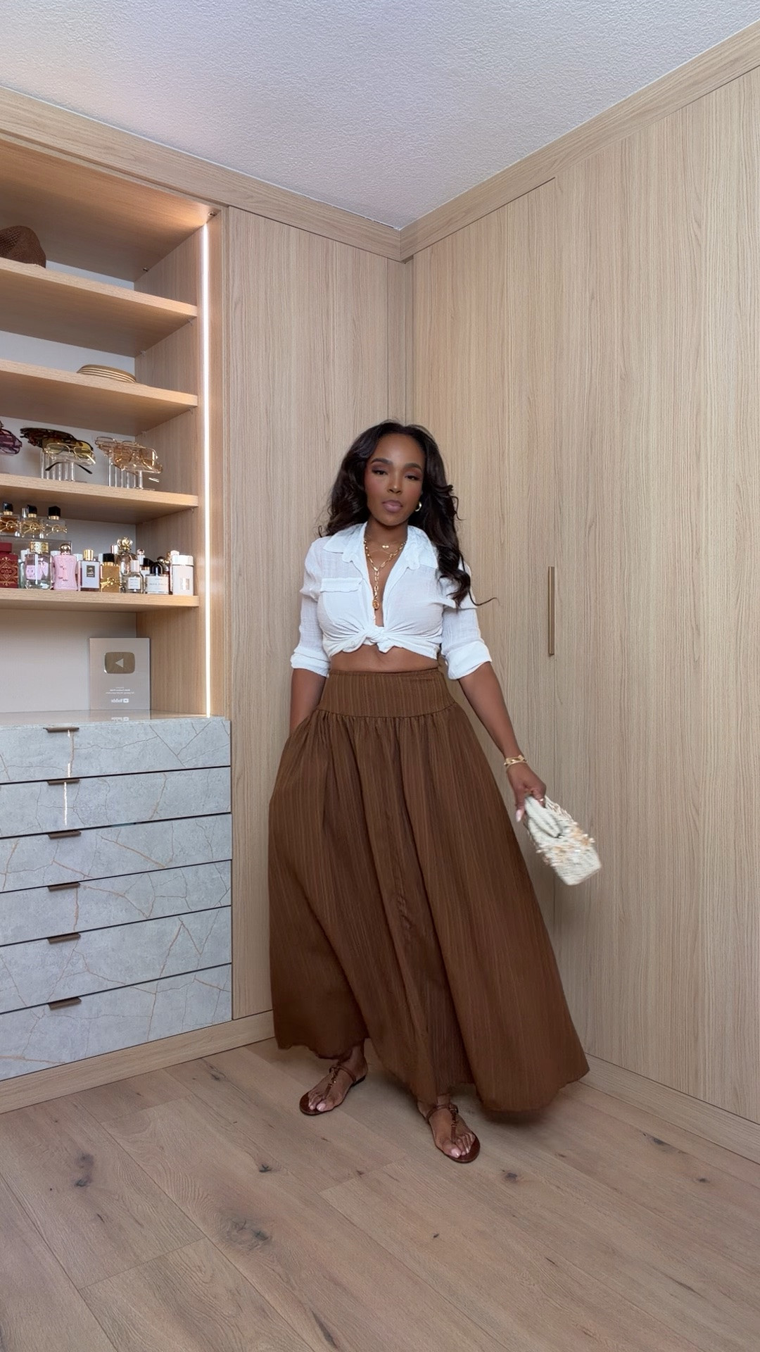 Hi Babes! 🤎

This outfit is giving effortless coastal chic! I love how the crisp white tied blouse pairs with this flowy chocolate maxi skirt—it’s timeless, flattering, and looks so elevated while still feeling comfortable.

✨ Fit Details:
• Wearing a Size Small
• Blouse is true to size with a relaxed fit
• Maxi skirt has a stretchy smocked waistband
• Lightweight, flowy fabric that's perfect for warm weather

🤍 Where to Wear:
• Vacation dinners
• Winery trips
• Brunch with the girls
• Farmers markets
• Resort vacations
• Summer date nights

✨ Style Tip:
Pair it with woven accessories, flat sandals or wedges, and layered gold jewelry for an effortlessly luxe summer look.

Everything is linked below!

xx, Kira | IG: KirasFashionFinds

Measurements:
5'4" | Size Small | 140 lbs