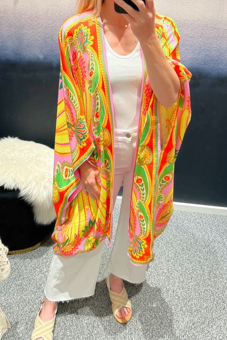 How fun is this swim cover up?  Totally in love with a draped sleeves and vibrant colors of this kimono and wrap. Wear it over your swimsuit or wear it with jeans and a tank. It’s versatile and great for your next vacation.

Swim | cover up | travel | pool | summer outfits | wide leg denim |  white denim | duster | farm rio

#LTKswim #LTKSeasonal #LTKtravel