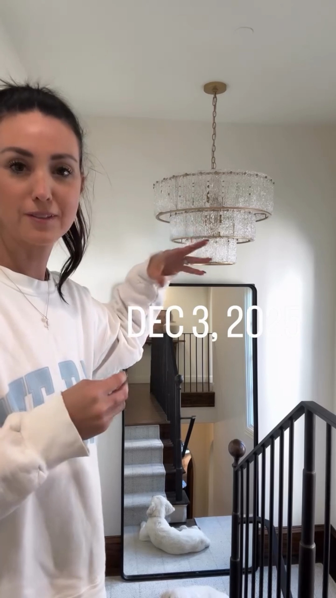 Installing the new glass chandelier in the staircase! 