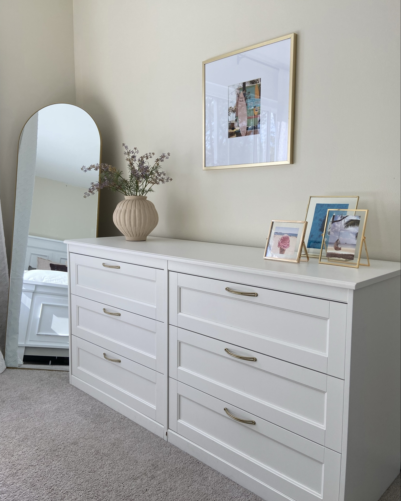 A feminine yet minimalist approach to your dresser.

Neutral haven with a pop of summer! 

It purchased this dresser from Ikea about two years ago and it has held up beautifully. I sprayed painted the handles gold to go with the decor. 
 Link a similar one from Amazon. 

#LTKhome #LTKstyletip