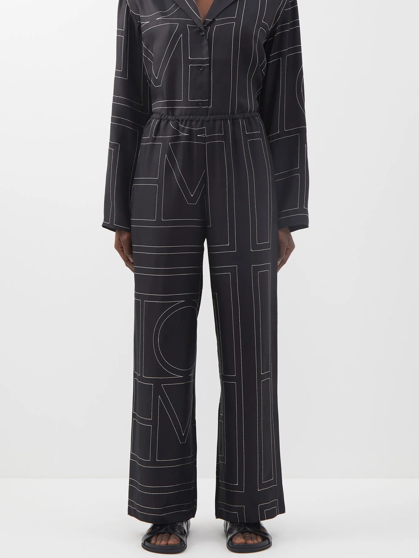 Monogram-embroidered silk-twill pyjama trousers | Toteme | Matches (US)