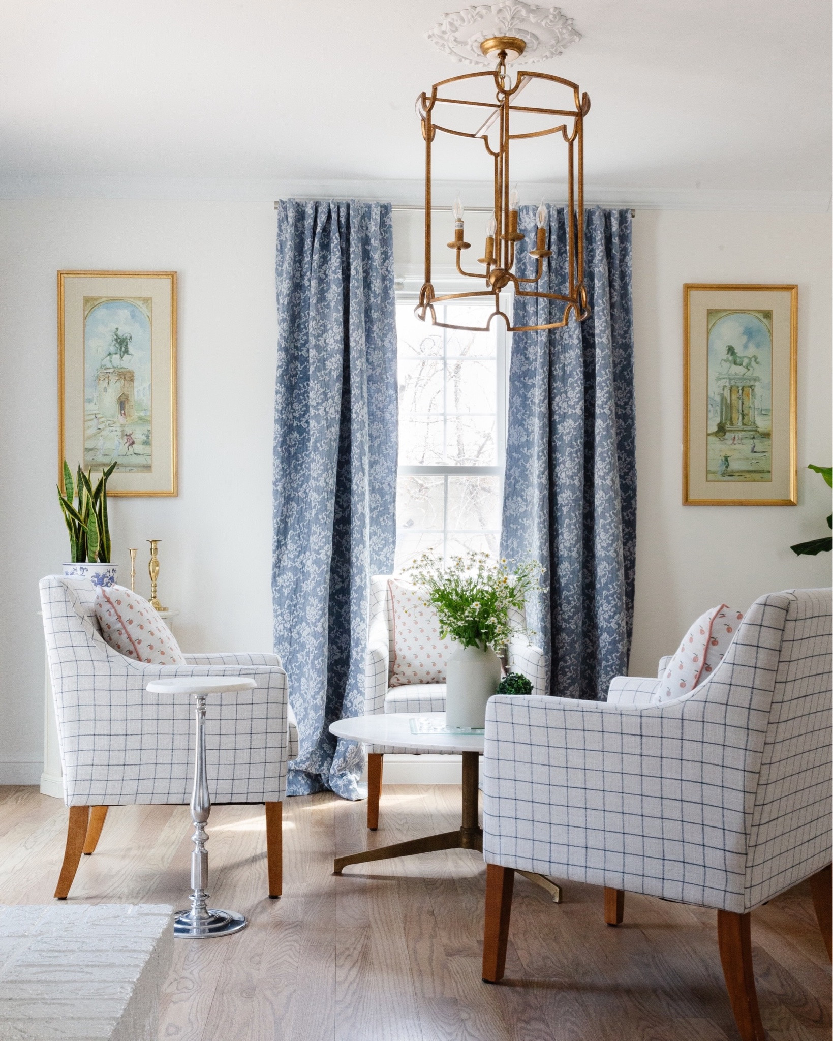 A long, narrow family room that also serves as the main walkway to the kitchen could have easily become one big design compromise. Instead, we used the unusual layout as an opportunity to create two distinct seating areas—one for everyday lounging and another with four chairs gathered around a round table for conversation, games, and perhaps a little tea. This is #projectgrandmillennial, after all. 😉

Our clients wanted a Southern + European, and classic look with a modern flair, so we layered tailored blue upholstery, traditional artwork, warm wood tones, playful pattern, and natural rattan accents that keep the room from feeling too formal.

The durable rug can handle plenty of foot traffic from three young children, while the fireplace, built-ins, ottomans, and flexible seating allow the room to work hard for real family life.

This is what I love about traditional design: it can feel elegant and collected while still being comfortable, practical, and completely ready to be lived in.

Design // @peggyhaddadinteriors
Photography // @karadeyoung

For sources and similar pieces from this space, comment SHOP and we’ll send the details your way.

https://liketk.it/5eixk
 

#PeggyHaddadInteriors #ProjectGrandmillennial #TraditionalInteriors #FamilyRoomDesign DenverInteriorDesigner