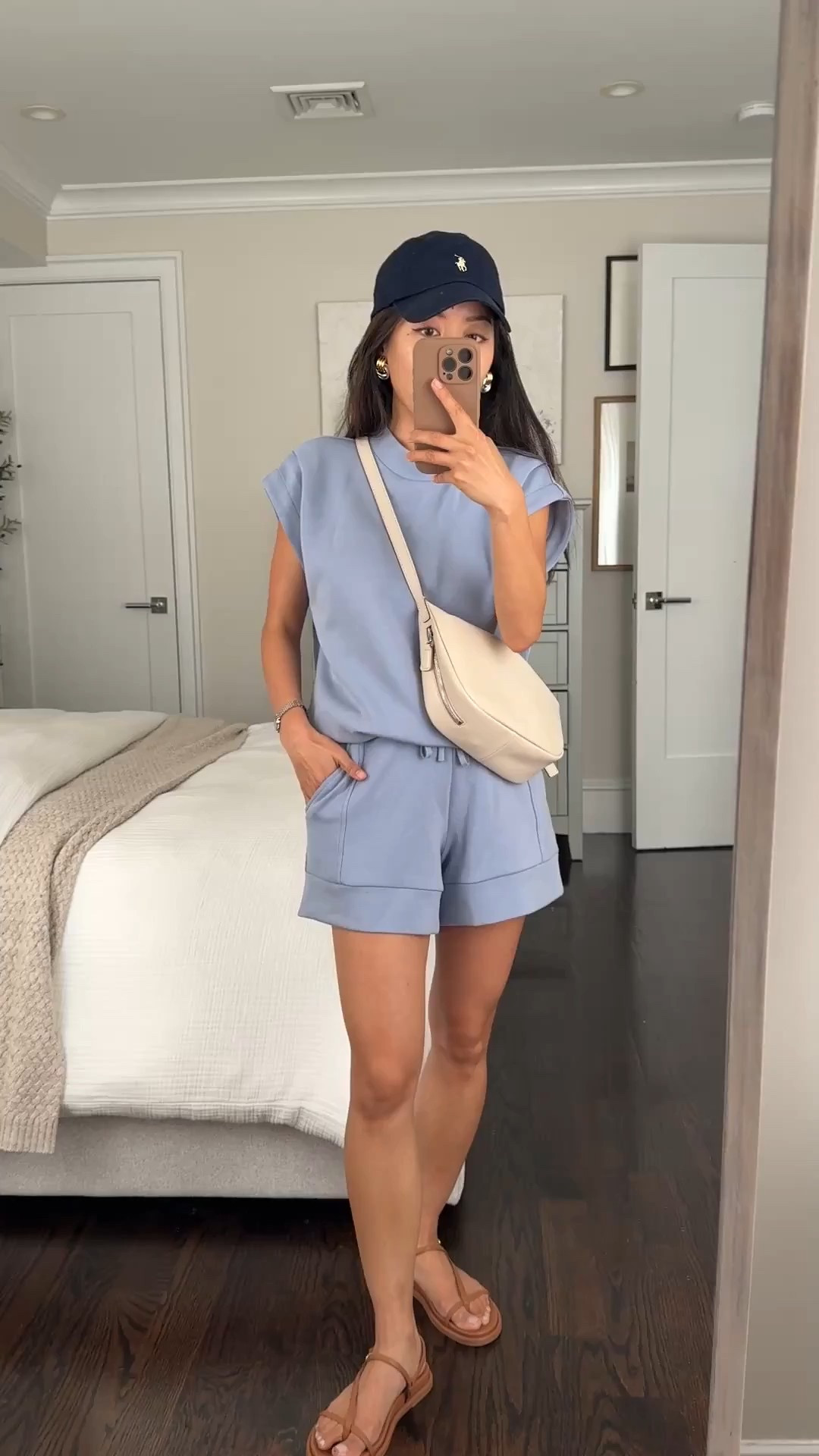 This gorgeous blue is back in stock! I found code HELLOVARLEY for 10% off your first order

Elevated comfy athleisure outfit in the prettiest color. I’ve worn this so many times with sneakers ( adidas and NB) , sandals, and mesh flats 

• Varley doublesoft Otis Sleeveless shirt in rain blue xxs so soft against the skin and a beautiful color, Top is a longer length with drawstring so you can tighten and tuck the length under and it stays in place all day  
 
A note about their double soft fabric is to be careful of non smooth handbags rubbing against it, esp straw totes might cause pilling. I use my sweater shaver to remove any pills

• Varley Atrium High-Rise Shorts in rain blue xxs great length even for petites that isn’t too short 

• neiwai bra one size so comfy 

• Dolce Vita sandals 5 

• Madewell bag is an older version, linked a similar amazon crossbody sling bag that is an amazing COS  look for less 

• polo hat from Shopbop 

• heaven mayhem mini knot earrings 

Petite friendly, athleisure, busy mom errands outfits, airport travel style

#LTKPetite #LTKTravel #LTKActive