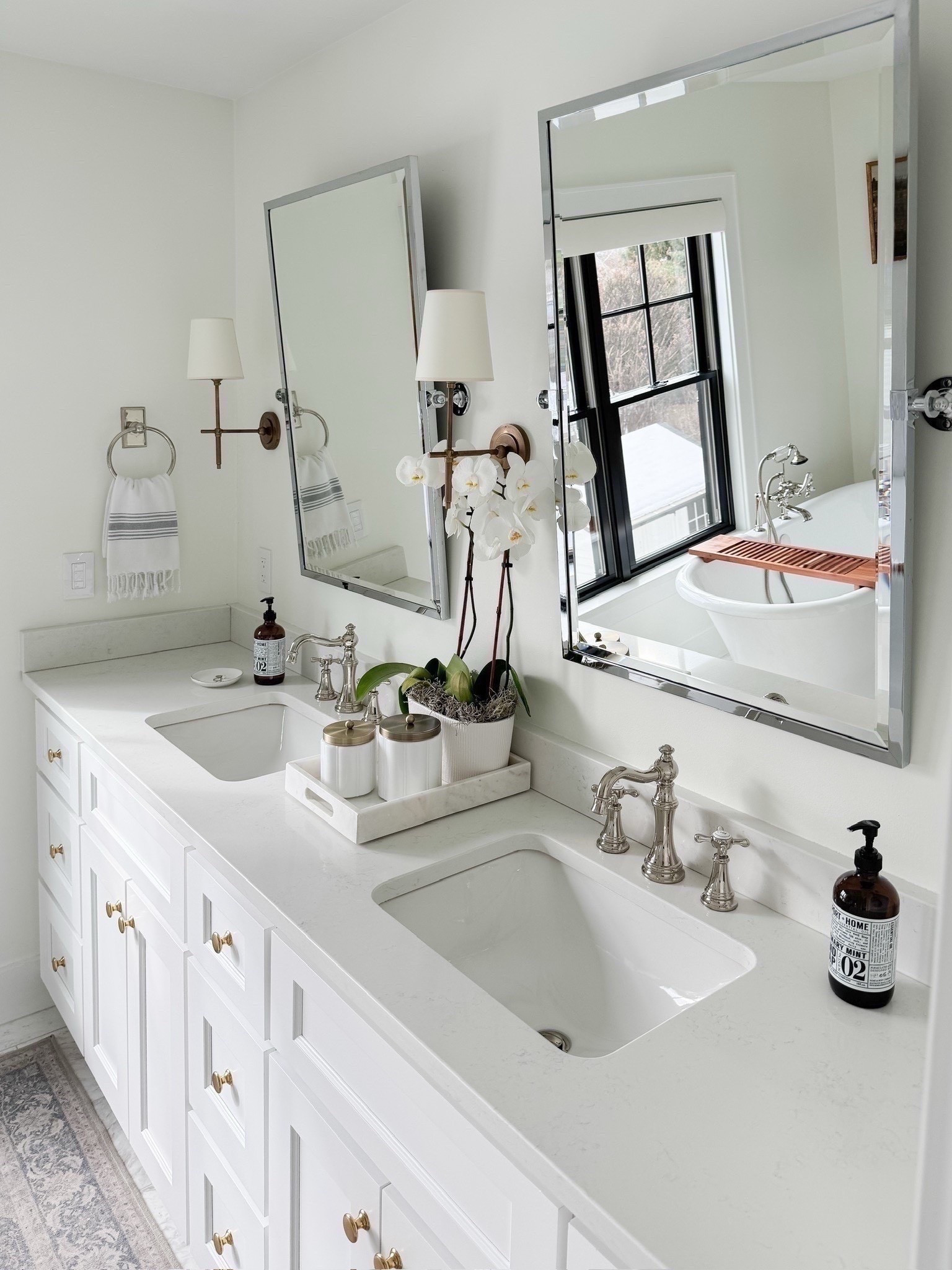 Shop my spa like white brass and marble bathroom. I am linking similar marble from Wayfair. My vanity was custom, but I am linking similar one. I used to mix metals in the space with polished nickel plumbing and brass sconces and knobs. My vintage style runner is washable and I’ve had it for almost 5 years now.

#LTKHome #LTKdayinmylife #LTKmomlife